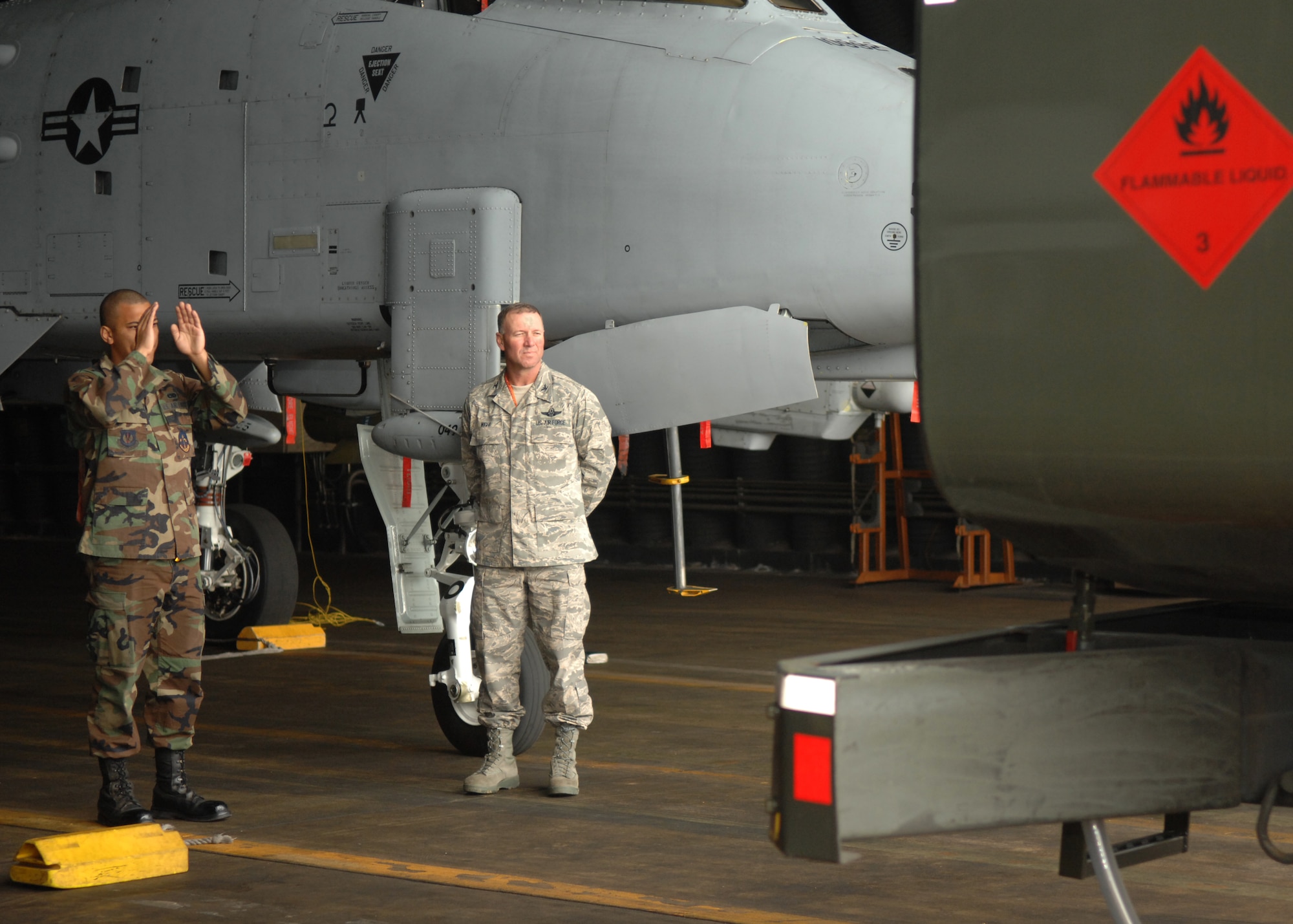 SPANGDAHLEM AIR BASE, Germany -- Airman 1st Class Dominic Arechiga, 52nd Aircraft Maintenance Squadron, marshals a fuel truck with Colonel Lee T. Wight, 52nd Fighter Wing Commander, as part of the Commander’s Shadow program, Oct. 24, 2008. (U.S. Air Force photo by Airman Staci Miller)