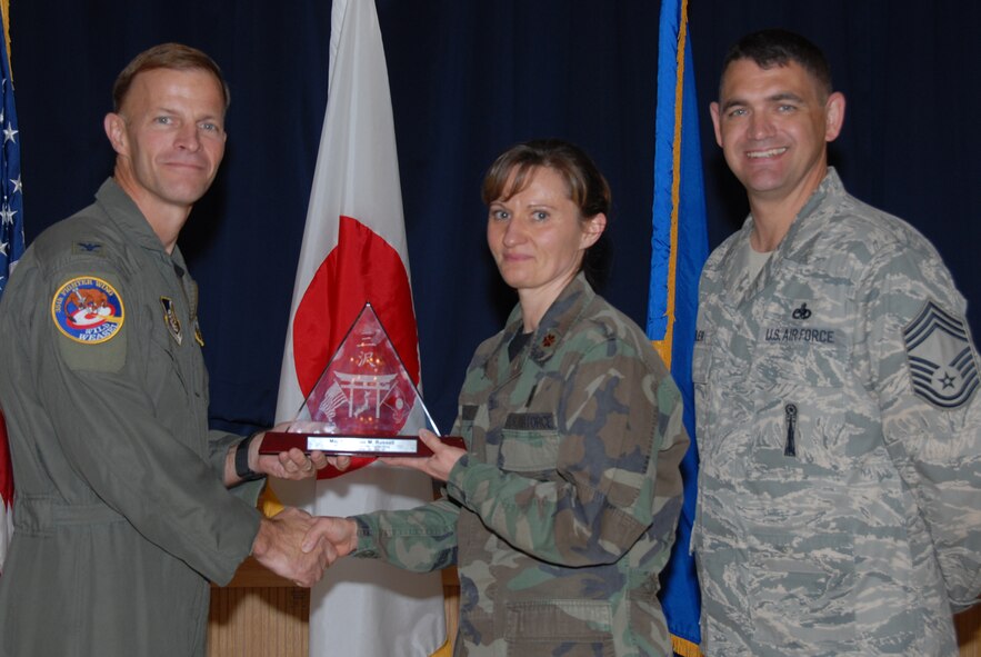 MISAWA AIR BASE, Japan -- Maj. Kimberlee Russell, 35th Surgical Operations Squadron, receives 35th Fighter Wing FGO of the Quarter during the wing quarterly award luncheon Oct. 24, 2008. Major Russell is a native of Chanute, Kan., and has been in the Air Force for 15 years. (U.S. Air Force photo by Senior Airman Laura R. McFarlane) 