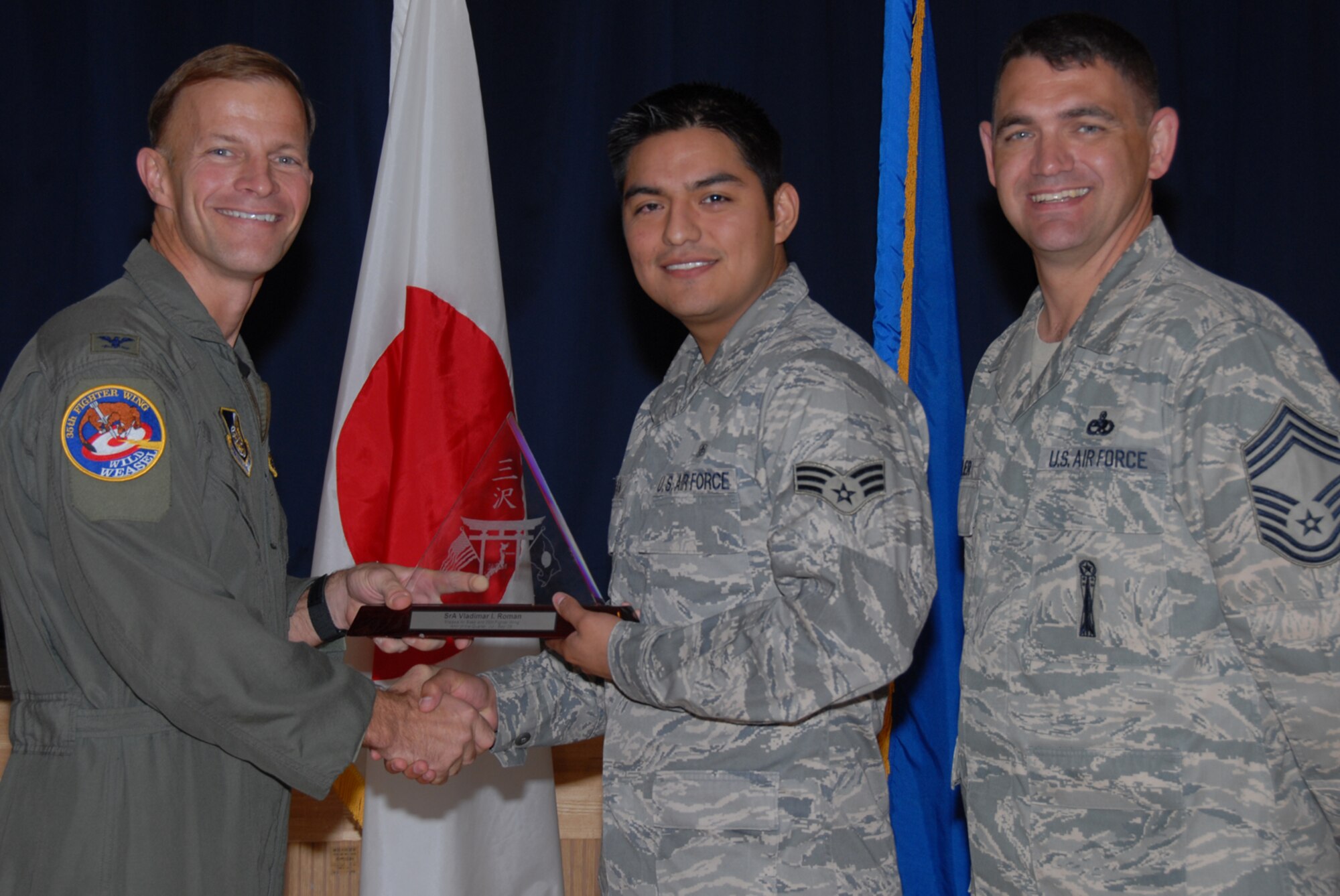 MISAWA AIR BASE, Japan -- Senior Airman Vladimir Roman, 35th Dental Squadron, receives 35th Fighter Wing Airman of the Quarter during the wing quarterly award luncheon Oct. 24, 2008. Airman Roman is a native of Burke, Va., and has been in the Air Force for five years. (U.S. Air Force photo by Senior Airman Laura R. McFarlane)