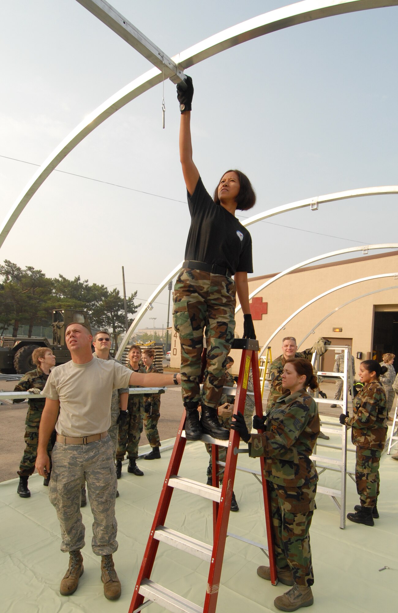 KUNSAN AIR BASE, Republic of Korea -- Senior Master Sgt. Delores Rivera, a 56th Medical Group reservist from Luke Air Force Base, Ariz. helps construct a madical staging facility here, Oct. 21.  Medical reservists from Luke AFB and Westover AFB are deployed here for training. (U.S. Air Force photo/Senior Airman Gustavo Gonzalez)
