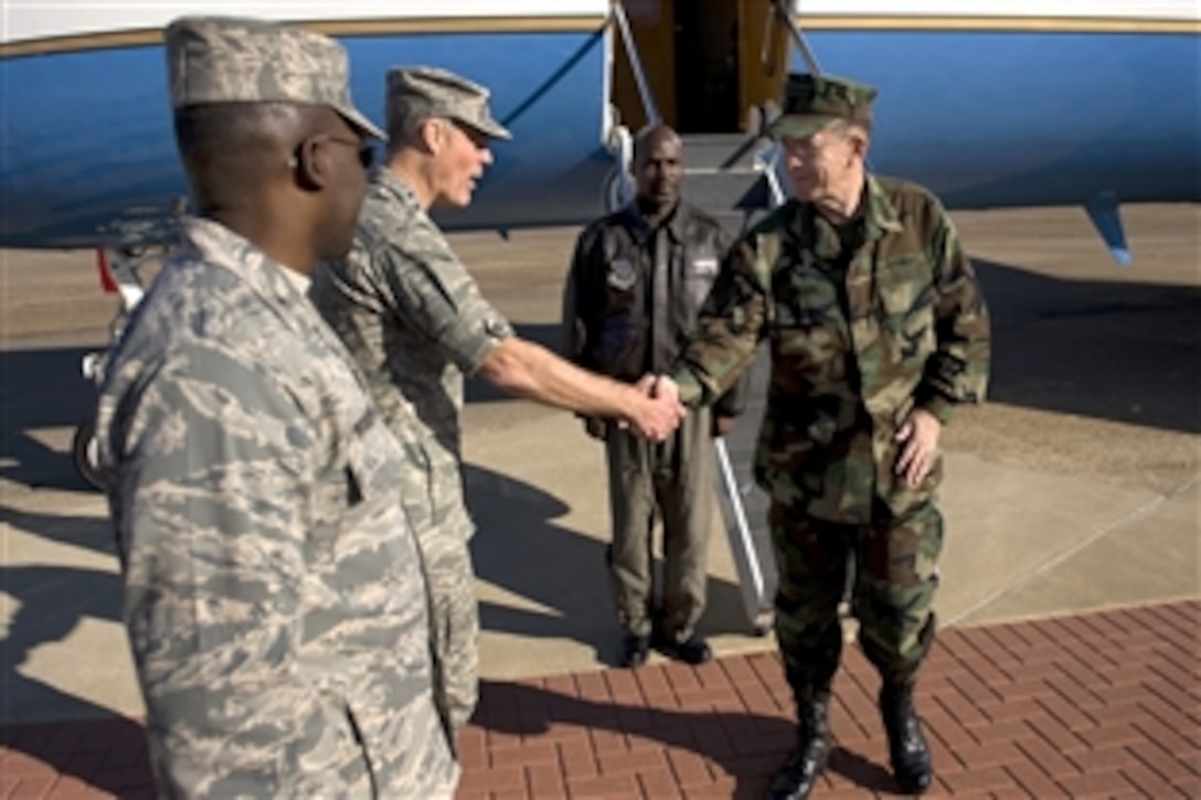 U.S. Air Force Lt. Gen. Al Peck and Col. Tyrone M. "Woody" Woodyard greet U.S. Navy Adm. Mike Mullen, chairman of the Joint Chiefs of Staff, upon his arrival on Maxwell Air Force Base, Montgomery, Ala., Oct. 28, 2008. Peck is commander, Air University, and Woodyard is vice commander, 42nd Air Base Wing. Mullen is visiting the base to speak to students assigned to the Air Command and Staff College and the Air War College. 
