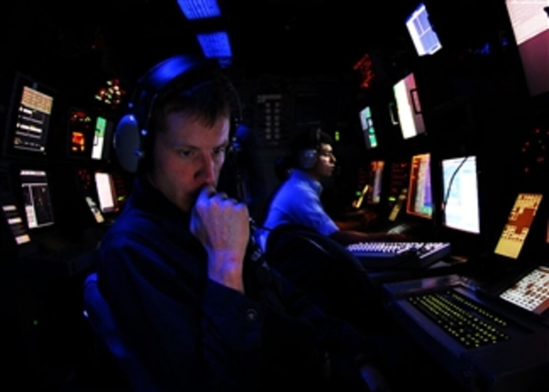 U.S. Navy Seaman Damian Bailey stands a radar watch in the combat direction center aboard the aircraft carrier USS John C. Stennis (CVN 74) while underway in the Pacific Ocean on Oct. 24, 2008.  The John C. Stennis Carrier Strike Group is conducting a composite training unit exercise off the coast of southern California.  