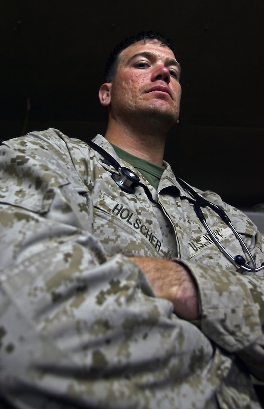 He’s a pillar of health, literally. At 6’3” and 210 pounds, armed with six years of college and eight years of military experience, Petty Officer 2nd Class John H. Holscher is a veritable tower of care and comfort for the people here, regardless of nationality. Not that any of them have a choice, because the next nearest medic is more than 100 kilometers away. 'The biggest challenge to being out here is being the only doc. (Iraqi) medics depend on me to train them, Iraqis patients depend on me, taking care of the Marines, going on every patrol, and then the villagers, I can’t take care of them all,' said Holscher, corpsman, Border Transition Team 4222.
