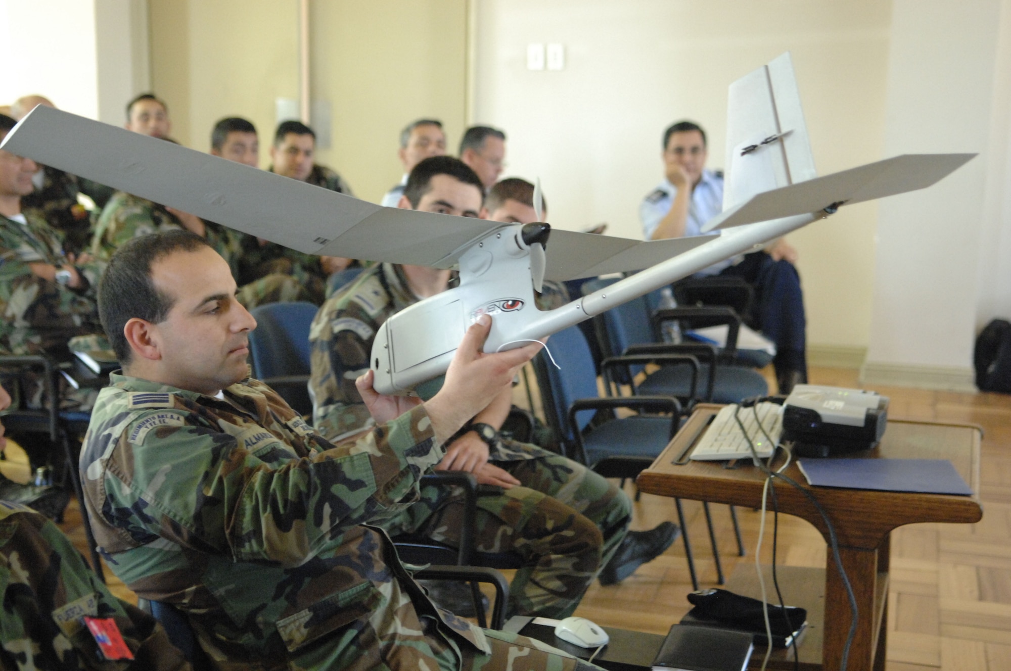 Chilean airmen examine a U.S. Air Force unmanned aerial system Oct. 29 at Quintero Air Base, Chile during an information exchange for Operation Southern Partner. The two-week operation is an in-depth, subject-matter exchange emphasizing partnership, cooperation and sharing of information with partner nation Air Forces in Latin America. (U.S. Air Force Photo/Tech. Sgt. Roy Santana)
