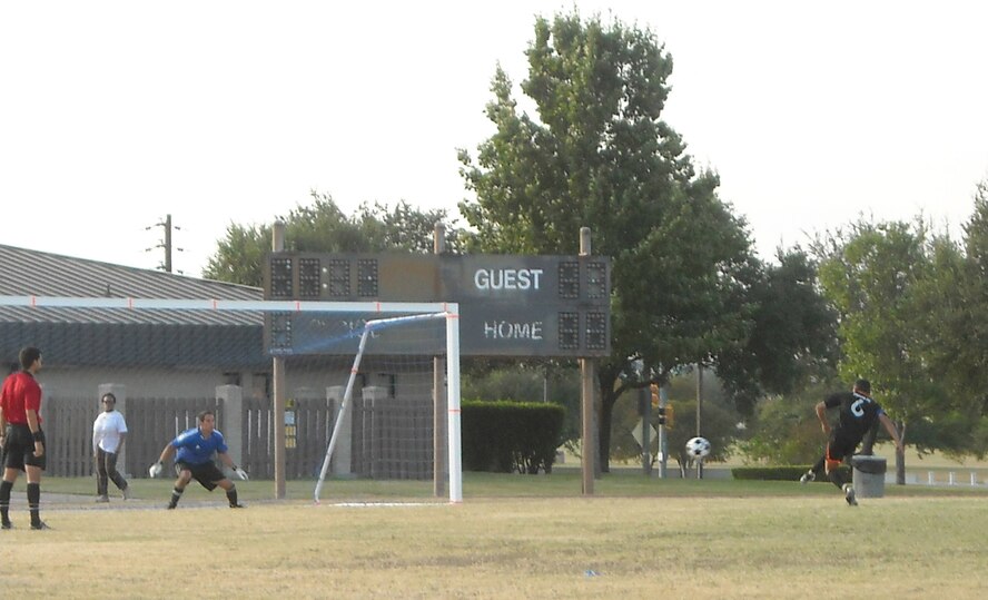 Jamie Cortes, the Travis soccer team player/coach, attemps a penalty shot during the quarterfinal game against Davis-Monthan Air Force Base, Ariz. The team would go on to lose the game and finish in fourth place for the tournament. (Courtesy photo)