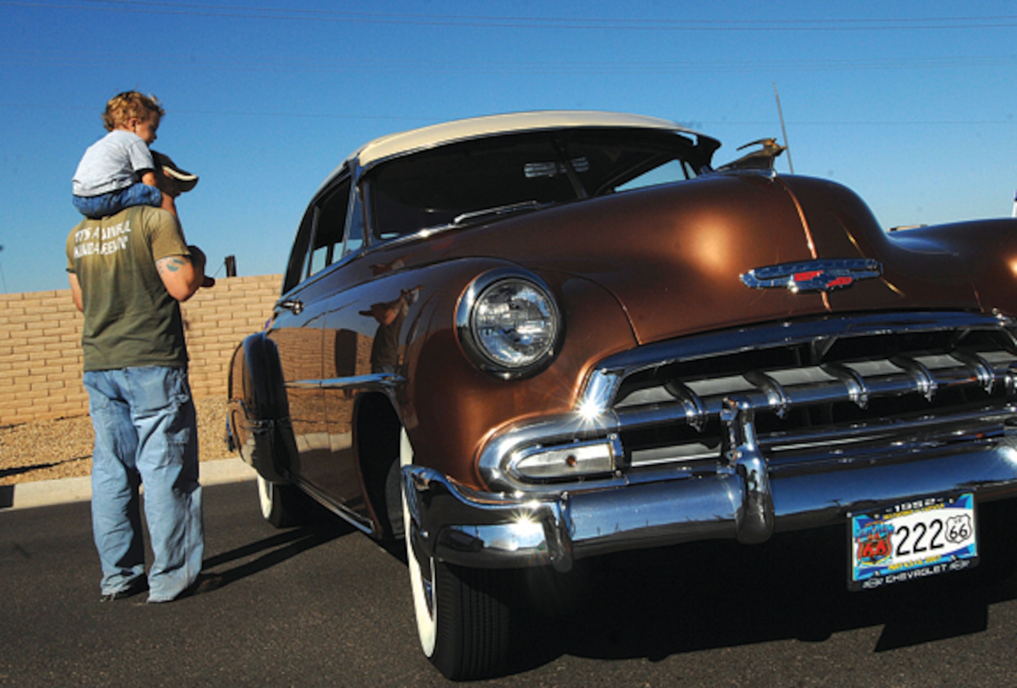 Father and son enjoy the Fall Festival car show where classics and modern day cars were on display. (U.S. Air Force photo/ Tech. Sgt. Jeffery Wolfe.)