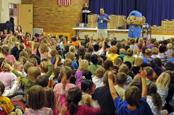 "Sammy Rabbit" and Sam Renick, author of the book, “It's A Habit, Sammy Rabbit!” teach children how to be financially responsible at Badger Clark Elementary, S.D., Oct. 30. Mr. Renick sang songs, told stories and discussed the importance of saving money. (U.S. Air Force photo by Airman Corey Hook)