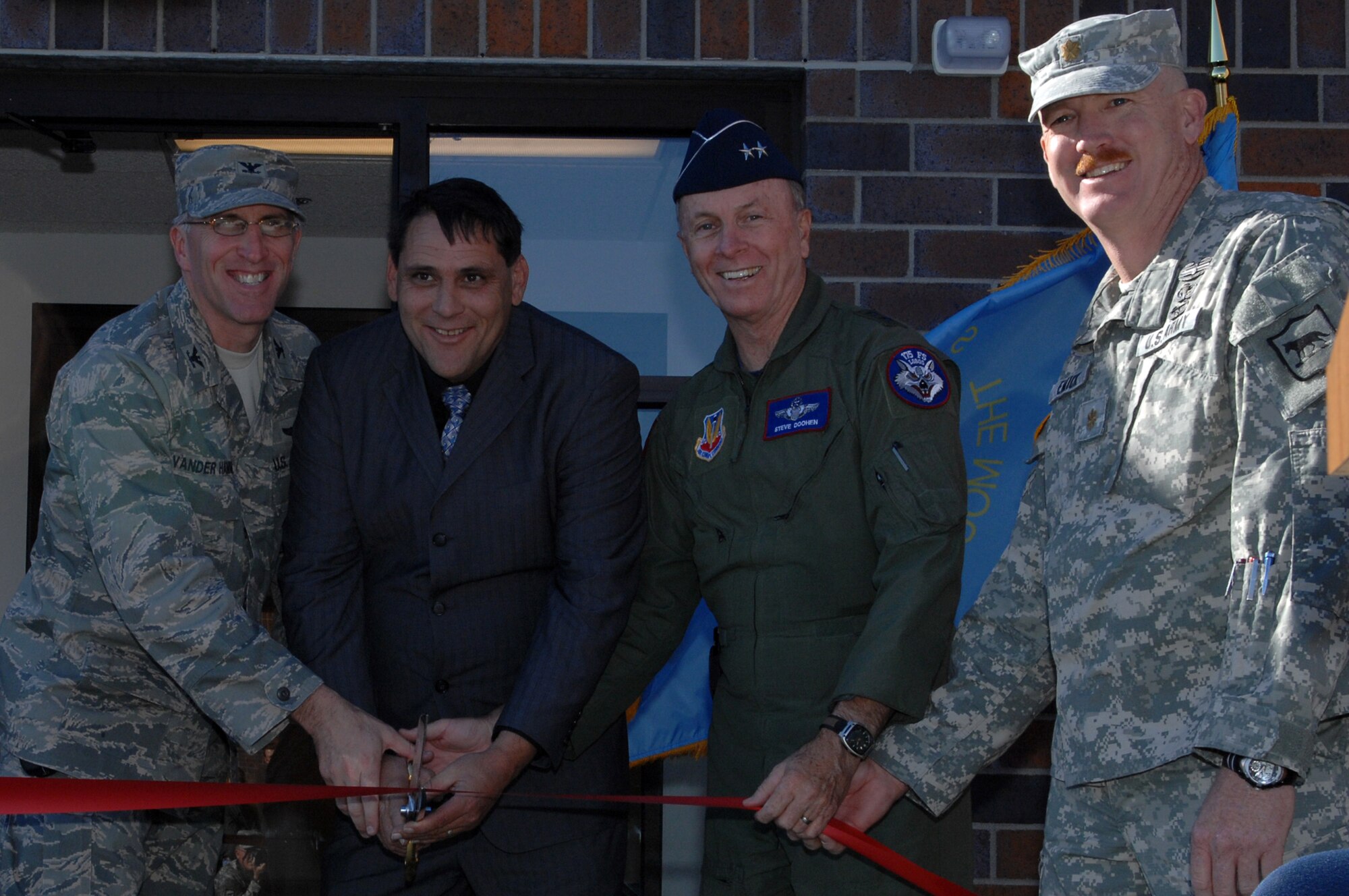 (Left to right) Col. Scott Vander Hamm, 28th Bomb Wing commander, Al Dial, Box Elder Mayor, Maj. Gen. Steven Doohen South Dakota National Guard adjutant general, and Maj. John Emick, 82nd Civil Support Team (Weapons of Mass Destruction) commander, cut the ribbon of the 82 CST building for it’s official opening here, Oct. 29. The 82 CST is one of 55 teams across the U.S. and its territories designed to integrate with the Incident Command System while providing a crucial link between initial local response and federal assets. (U.S. Air Force photo/Airman 1st Class Joshua J. Seybert)