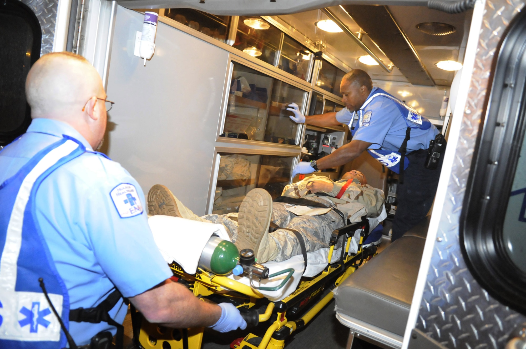 A "victim" is loaded into an ambulance for transport to a local hospital from the simulated aircraft crash scene. U. S. Air Force photo by Sue Sapp