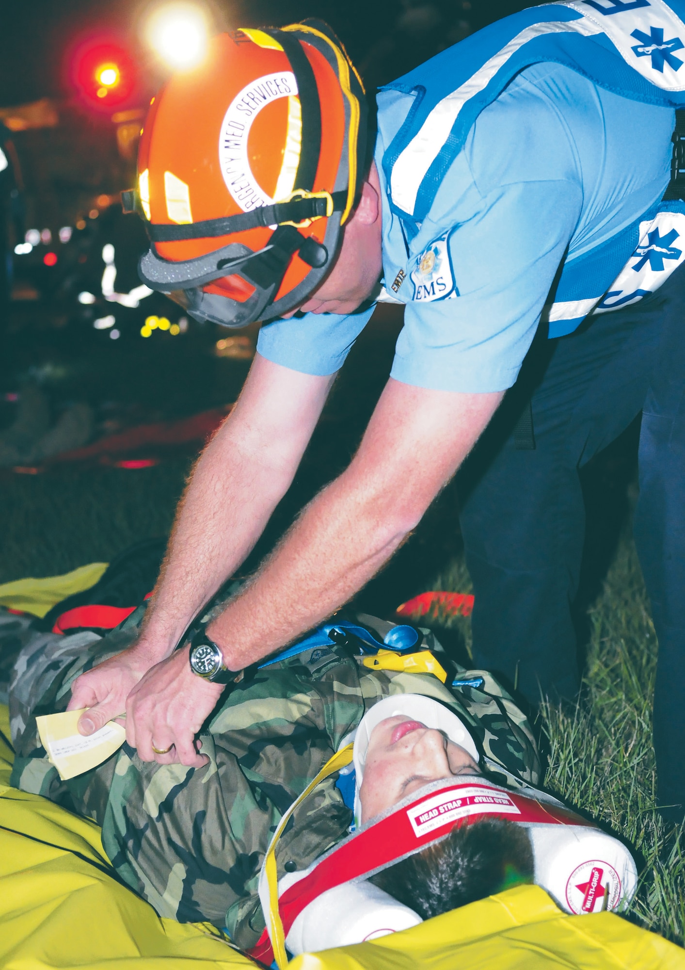 An emergency responder takes care of a "victim" in the triage area of a simulated aircraft crash scene. Base and local emergency personnel took part in an exercise Oct. 22 to prepare in the event of an actual crash. U. S. Air Force photo by Sue Sapp
