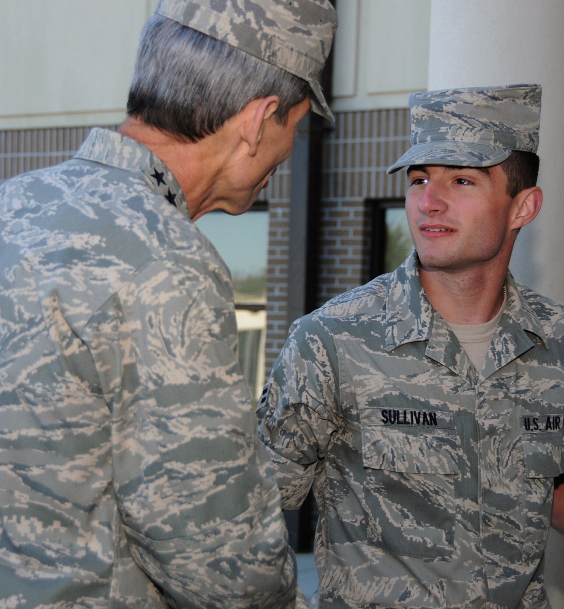 Airman 1st Class Michael Sullivan, 334th TRS, welcomes General Schwartz to the
LevitowTraining Support Facility for the Airman’s Call Oct. 28.  (U.S. Air Force photo by Kemberly Groue)