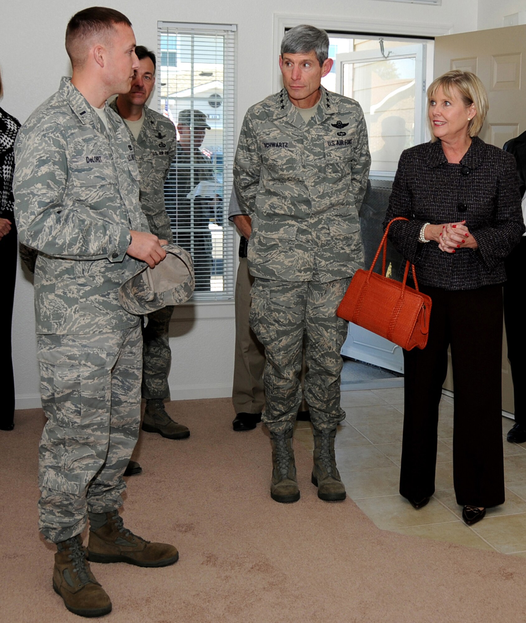 From left, 1st Lt. Justin Delorit, 81st Civil Engineer Squadron,
tells General and Mrs. Schwartz about a new home in Northwest
Falcon Park, one of more than 700 Leadership in Energy
and Environmental Design homes being constructed at Keesler.
The largest military housing construction project in Air Force
history is currently under way at Keesler and will add more
than 1,000 homes for officers and enlisted members.  (u.S. Air Force photo by Kemberly Groue)