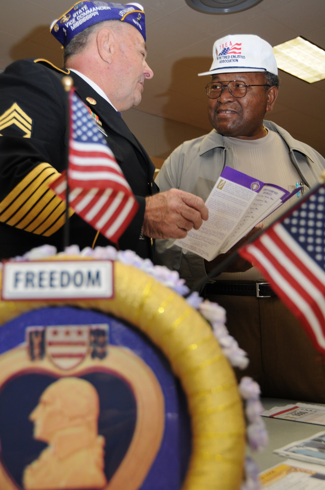 Retired Army Staff Sgt. Joseph “Snake” Balanovich of Pass Christian, left, Mississippi Purple Heart vice commander, chats with retired Chief Master Sgt. Chris Moore of Biloxi during Retiree Appreciation Day Friday at Locker House’s Dragon’s Den.  (U.S. Air Force photo by Kemberly Groue)
