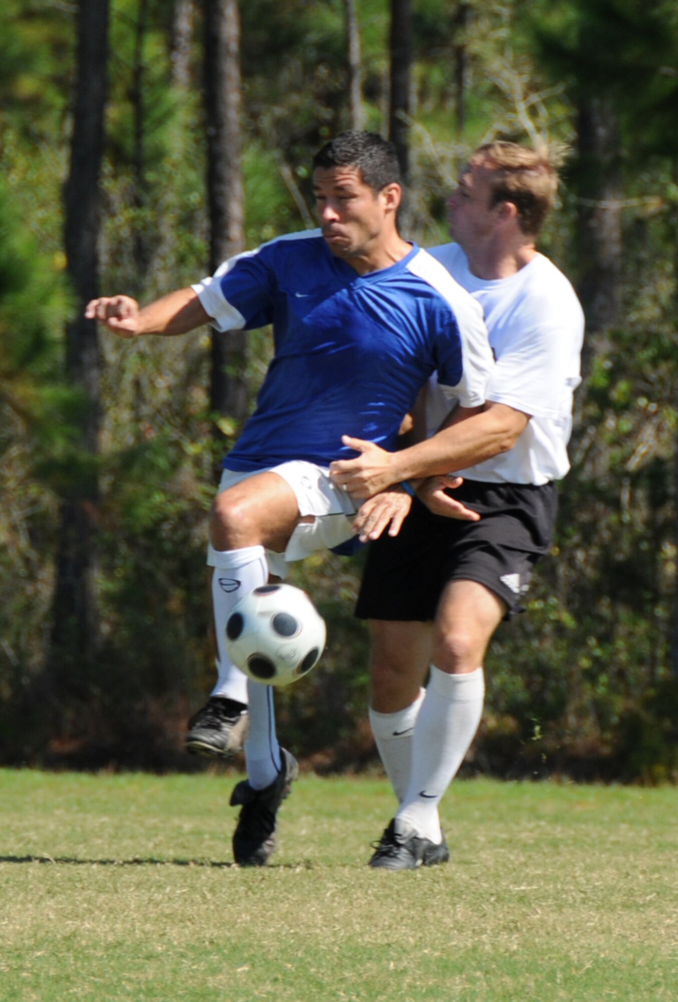Ranson Coleman, left, a member of Keesler's varsity soccer team, keeps the ball away from Jeff French, a member of Super Bad, during a Gulf Coast Soccer Organization game Sunday at  the Jackson County Soccer Complex in Gautier.  Keesler lost, 7-2.