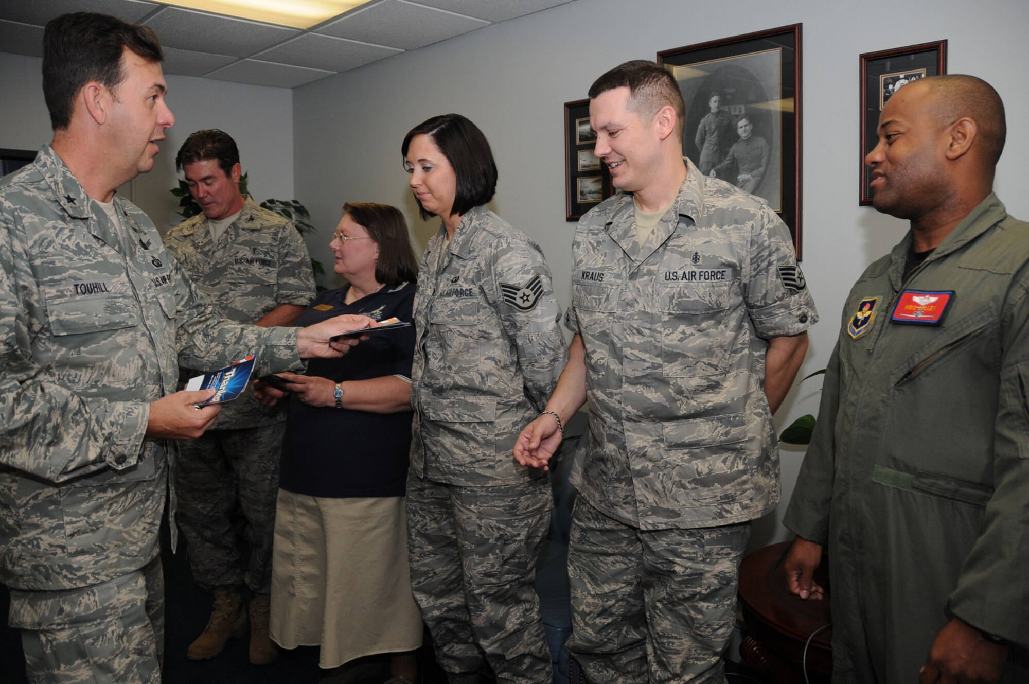 From left, Brig. Gen. Greg Touhill, 81st Training Wing commander, recently presented wing coins to Col. William Dunn, 81st Dental Squadron; Lana Smith, 81st Force Support Squadron; Staff Sgt. Rachel Keener, 334th Training Squadron; Staff Sgt. Shawn Kraus, 81st Diagnostics and Therapeutics Squadron, and Maj. Kris Colley, who represented Capt. William Fields, currently deployed from the 45th Airlift Squadron, for their involvement in the 2009 air show slogan contest.  Captain Fields' submission, Thunder on the Bay, was selected by a base-wide vote by nearly 1,100 Keesler members.  The air show is slated for April 4-5, 2009.   Coordinators are working to secure top-quality performance and static aircraft for the event, including the Air Force Thunderbirds demonstration team.  (U.S. Air Force photo by Kemberly Groue)