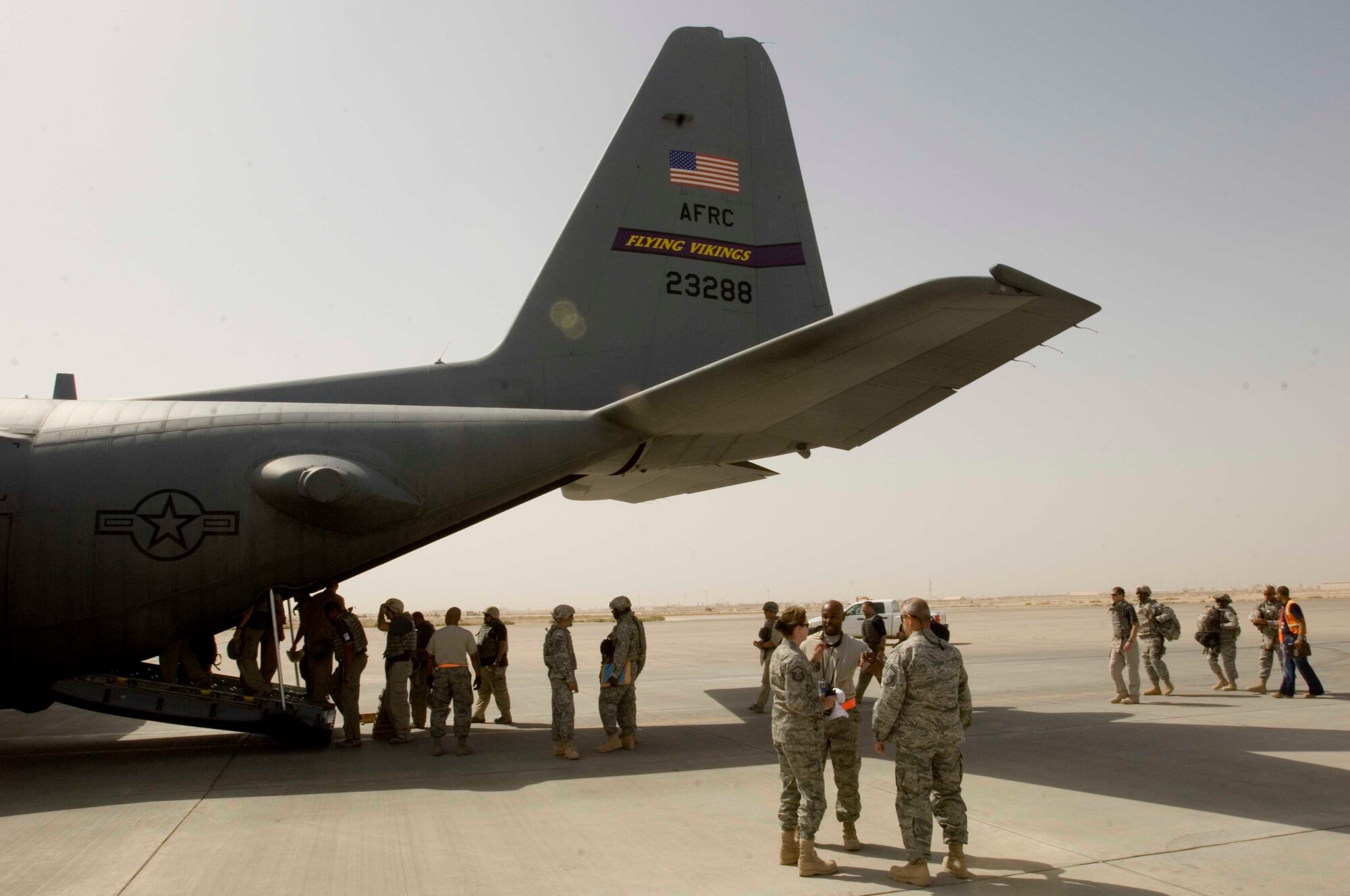 Passengers board a 934th Airlift Wing C-130 Hercules cargo aircraft at Joint Base Balad Oct. 6, 2008. The C-130 provides heavy airlift capability throughout the U.S. Central Command area of responsibility regardless of runway conditions or weather, day or night.  (U.S. Air Force photo/Tech. Sgt. Erik Gudmundson) 

 

 

 

 

 

 

 

