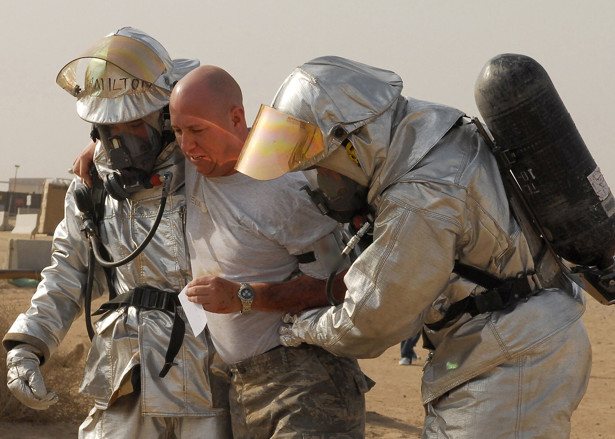 SOUTHWEST ASIA -- Firefighters from the 386th Expeditionary Civil Engineering Squadron transport a patient during a mass casualty exercise on Oct. 29 at an air base in Southwest Asia. The exercise tested the 386th Air Expeditionary Wing's ability to respond to a major accident in a deployed environment. (U.S. Air Force photo/Airman 1st Class Nicole Brosseau)