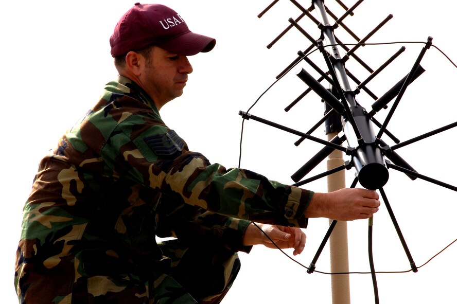 Tech. Sgt. Don Colbert, course director for the U.S. Air Force Expeditionary Center's Mobile Command, Control and Communications Systems Course, works on adjusting an antenna on the Hard-sided Expandable Lightweight Air Mobile Shelter, or HELAMS, in the Mobility Operations School's Mobile C3 training facility on Fort Dix, N.J., Oct. 29, 2008.  The HELAMS is the Air Force's newest shelter being fielded to contingency response forces to serve as mobile command posts in a bare-base environment.  (U.S. Air Force Photo/Tech. Sgt. Scott T. Sturkol)