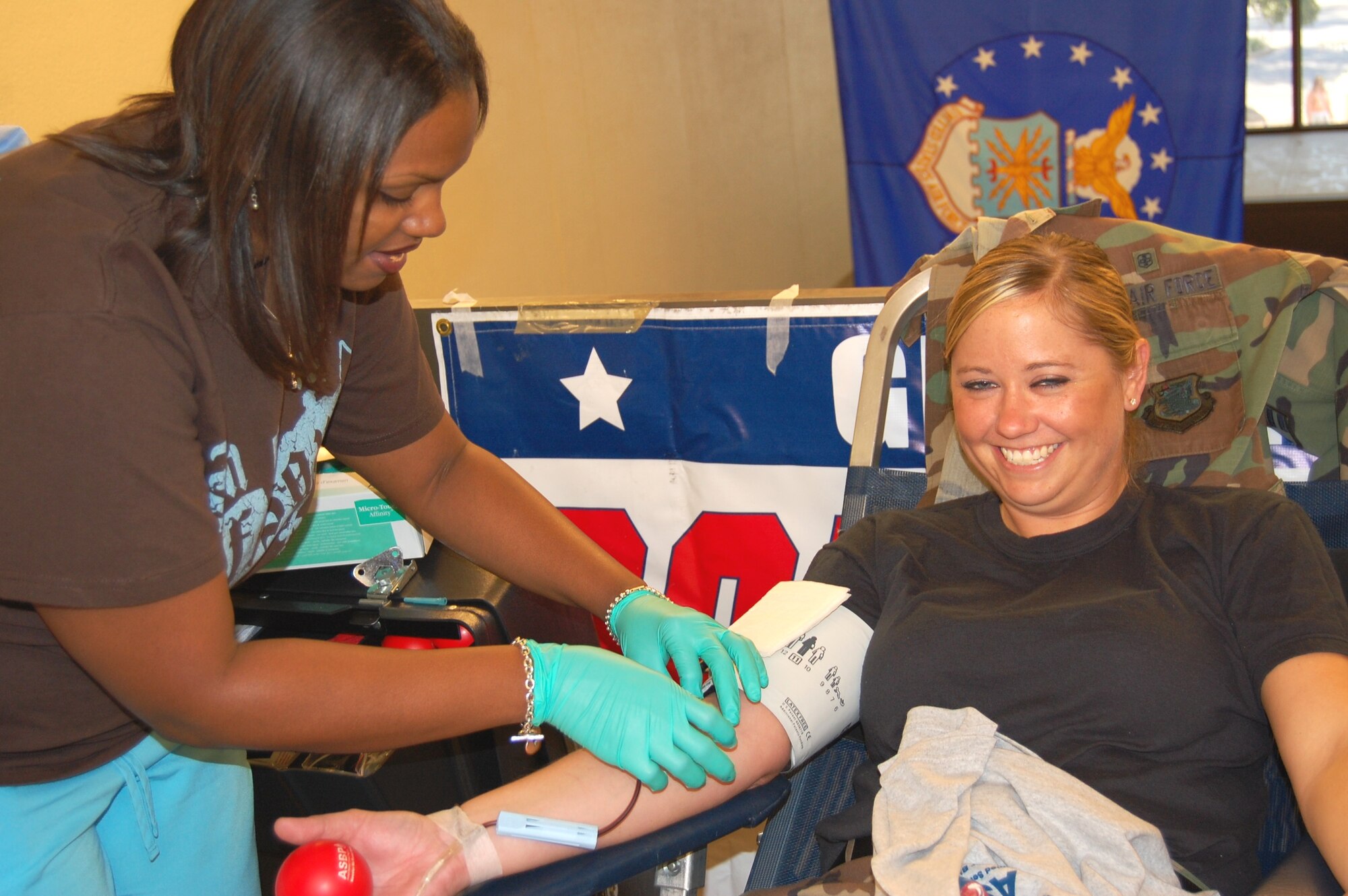 Cookie Thompson, Keesler Blood Donor Center, draws blood from Airman 1st Class Kathryn Barber, 81st Medical Operations Squad-ron, during a drive Oct. 21 at Keesler Medical Center.  In five hours, 71 people were registered and interviewed and 46 units of blood were collected.  The center, 376-6100, is open 8 a.m. to 4 p.m. Monday-Thursday and 8 a.m. to 3 p.m. Friday.  To schedule a blood drive, call Lisa Lynn, donor center and Armed Services Blood Program recruiter, 376-6106 or 1-504-606-5579.  (U.S. Air Force photo by Steve Pivnick)