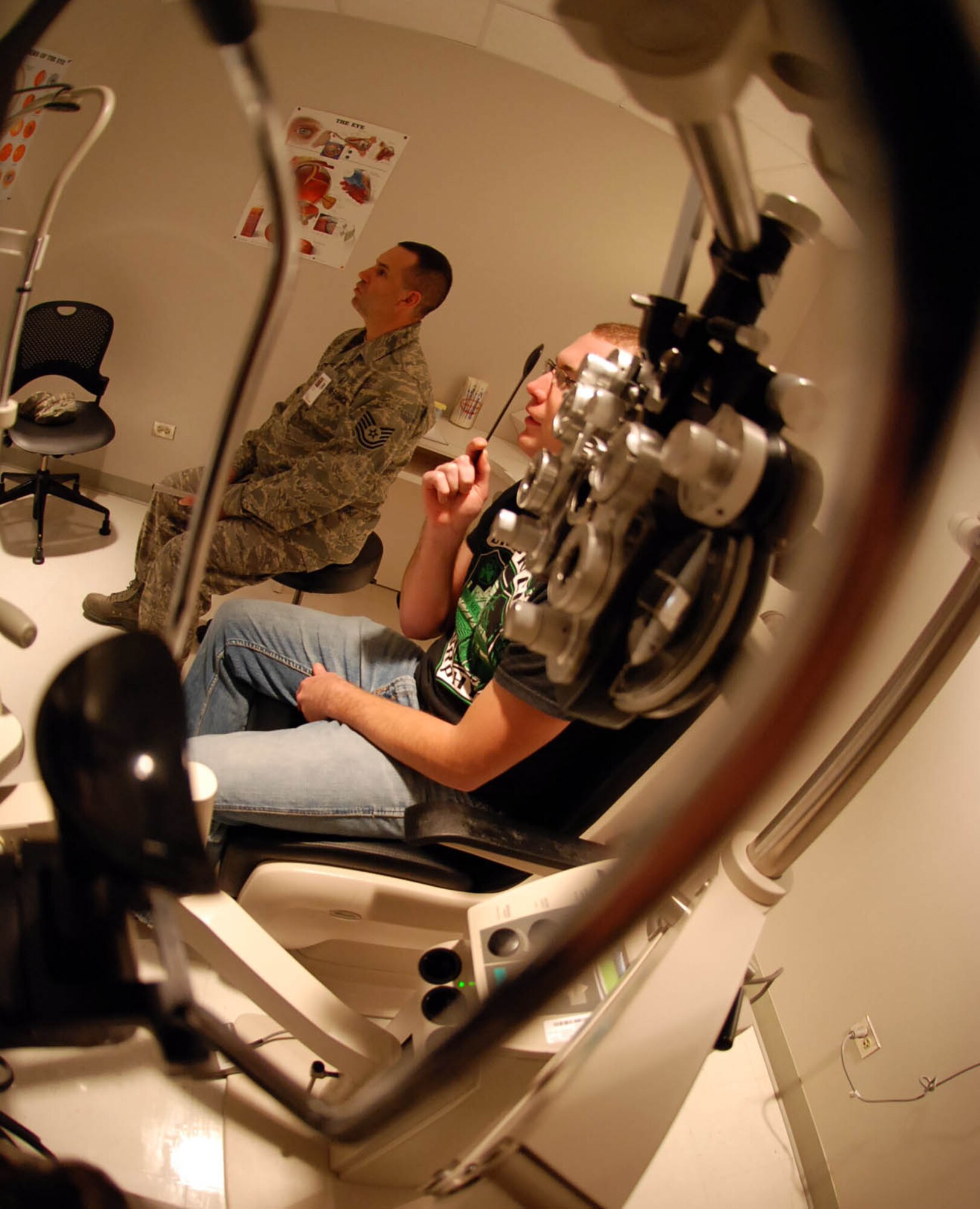 LAUGHLIN AIR FORCE BASE, Texas – Tech Sgt. Thomas Lawson, 47th Medical Operations Squadron optometry technician , conducts an eye exam on Airman 1st Class Ryan Vandewynkel , 47th Operations Support Squadron, in order for him to wear contacts at the base clinic Oct. 28. The optometry clinic’s mission here is to ensure Laughlin members have healthy eyes and optimal vision to accomplish their duties. (U.S. Air Force photo by Airman 1st Class Sara Csurilla)