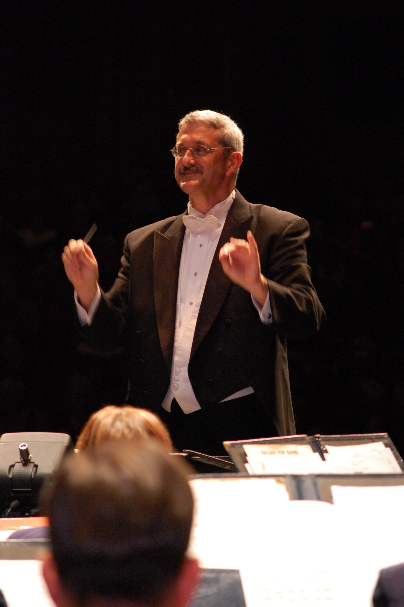 Dr. Milton Allen conducts the Concert Band