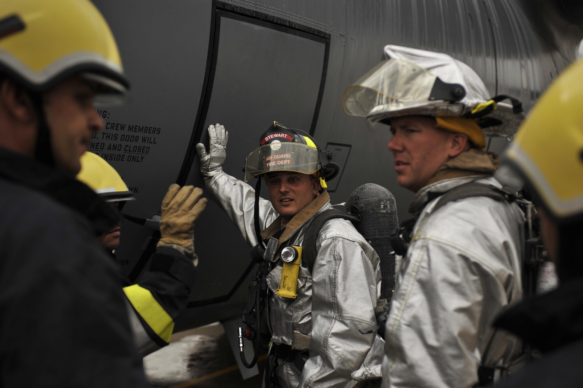 10/29/2008 ? NEW AL MUTHANA AIR BASE, Iraq - Master Sgt. John Bell (center), and Staff Sgt. Dale Catlett (right) work with Iraqi firefighters on a combined training exercise that was aimed at developing American and Iraqi cooperation in the event of an aircraft fire. Sergeants Bell and Catlett are assigned to the 447th Expeditionary Civil Engineer Squadron and are deployed from the 105th Airlift Wing at Stewart Air National Guard Base in New York. (U.S. Air Force photo by Master Sgt. Brian Davidson)
