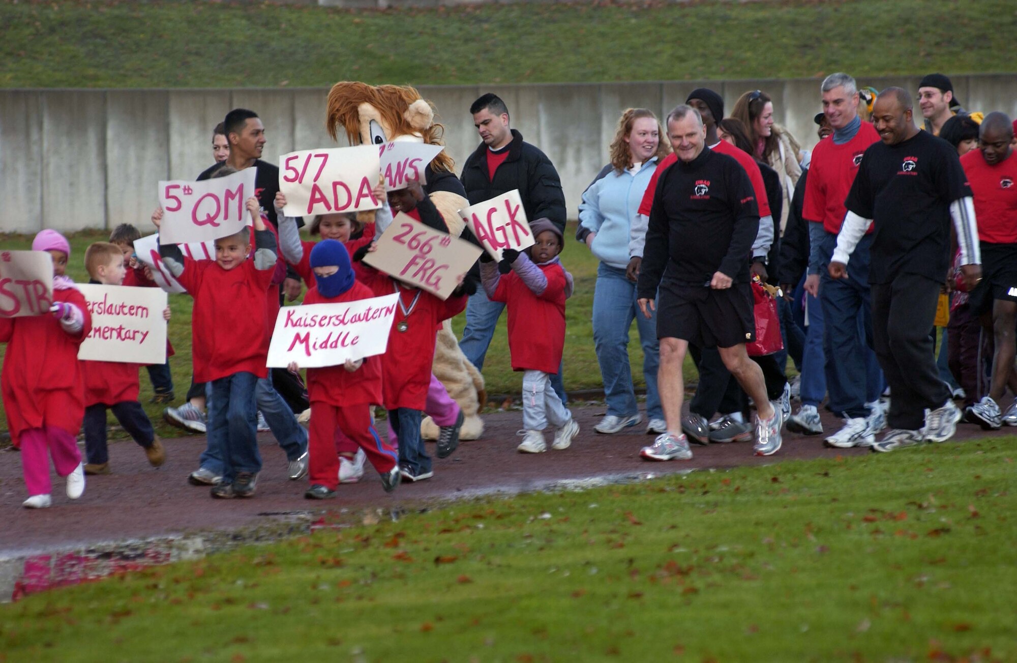 More than 630 Soldiers, Airmen, civilians and their family members from 13 local agencies and units participate in the U.S. Army Garrison Kaiserslautern's Red Ribbon Relay held Oct. 25 at the track near the Vogelweh Commissary. This is more than double the number of people who participated last year. Close to 70 community members volunteered for the event. U.S. Army photo by Christine June.       

        