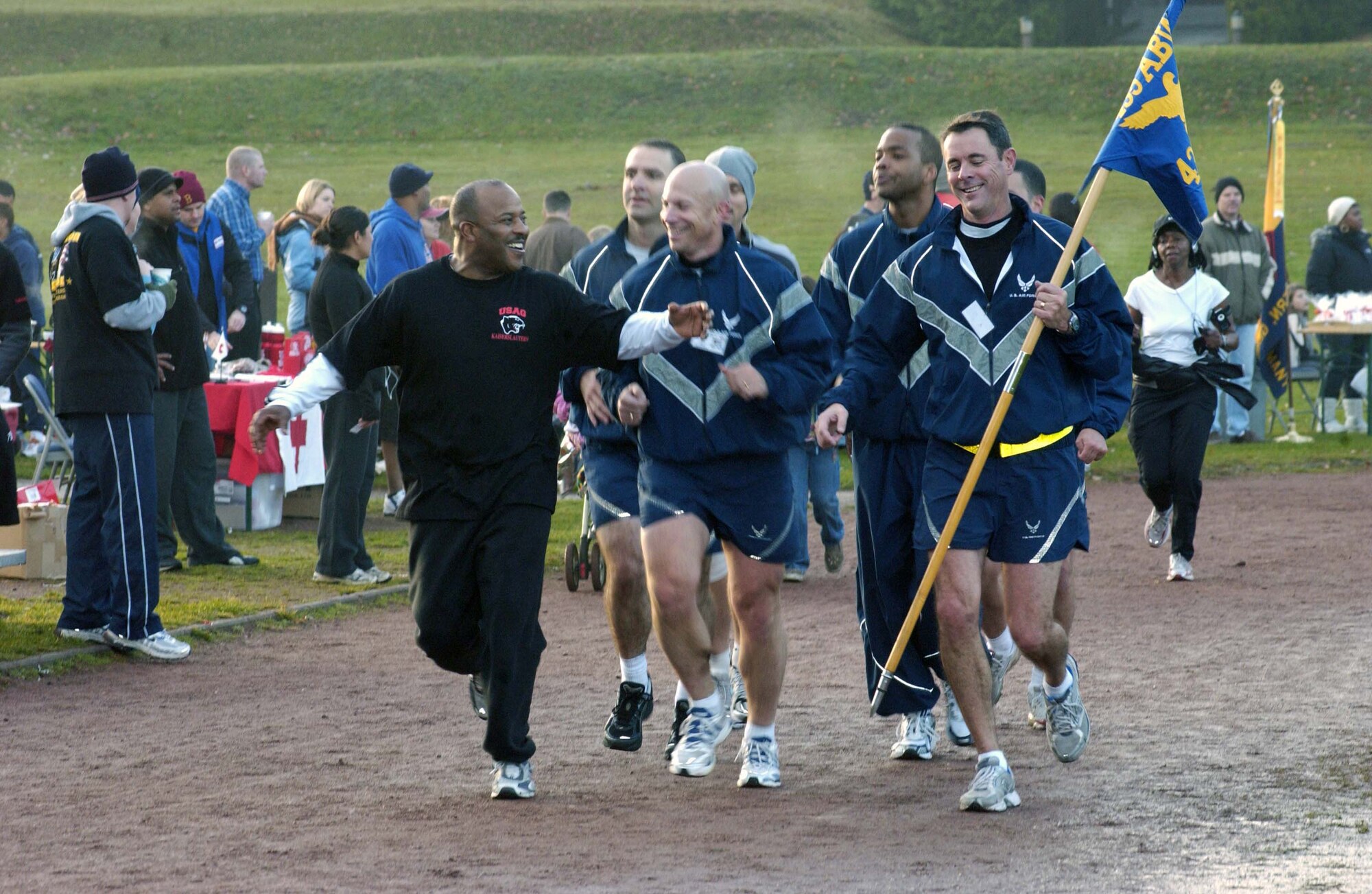 'No thanks'

The U.S. Army Garrison Kaiserslautern's Command Sgt. Major Richard Jessup (left) jokes with Col. Francis Brown (right), the 431st Air Base Group commander, about carrying the unit's Guidon Oct. 25 during the garrison's Red Ribbon Relay at the track near the Vogelweh Commissary. More than 630 Soldiers, Airmen, civilians and their family members ran laps - more than double the number of people who participated last year. 

The 431st ABG's participation in the relay marks the first by an Air Force unit. Close to 70 community members volunteered for the event, which supports Red Ribbon Week. This national observance encourages everyone in the community to take a visible stand against drugs, alcohol and tobacco. U.S Army photo by Christine June. 

  