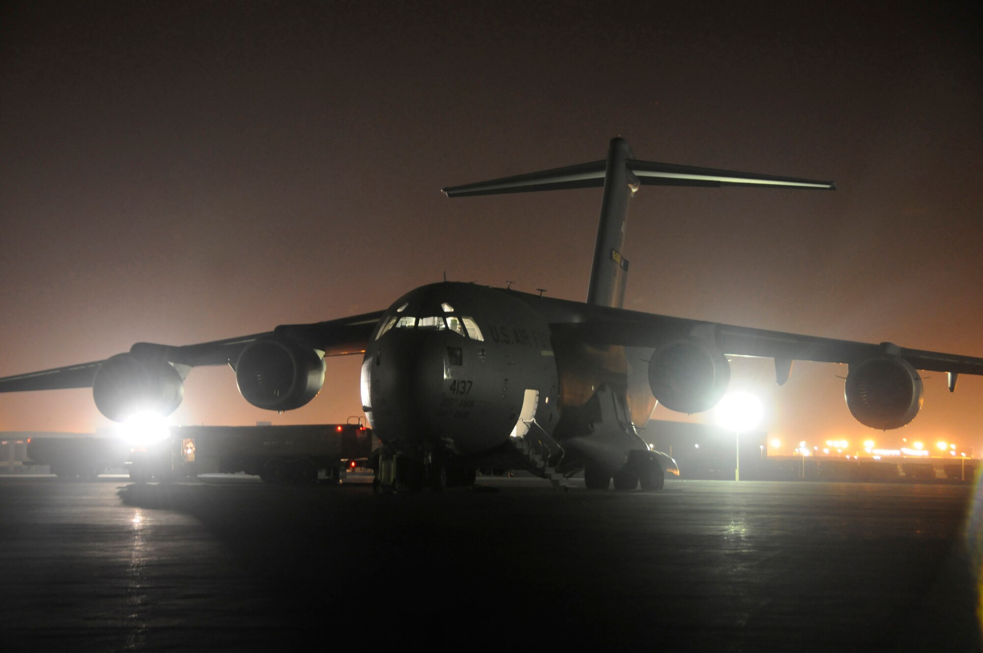 A C-17 Globemaster III is refueled at an undisclosed air base in Southwest Asia in preparation for another mission resupplying the Global War on Terrorism Oct. 29. The C-17 is the U.S. Air Force's premier cargo aircraft, capable of both strategic and tactical airlift, and is a mainstay in supporting Operations Iraqi and Enduring Freedom and Joint Task Force-Horn of Africa.  (U.S. Air Force photo by Staff Sgt. Darnell T. Cannady/Released)