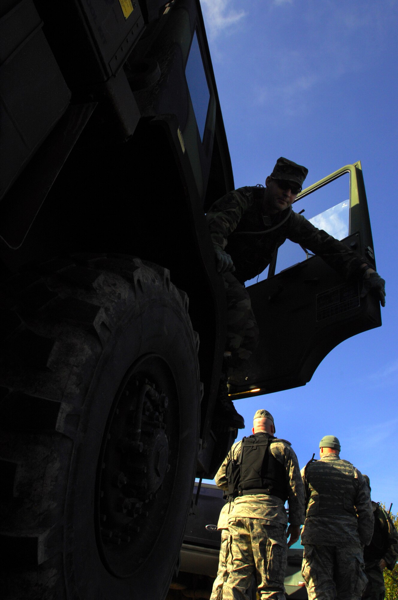 Senior Airman Chris Falvin, 786th Security Forces Squadron, dismounts a Light Medium Tactical Vehicle after convoy during a week-long Creek Defender cadre instructor?s course, Baumholder, Germany, Oct. 23, 2008. (U.S. Air Force photo Airman 1st Class Kenny Holston)