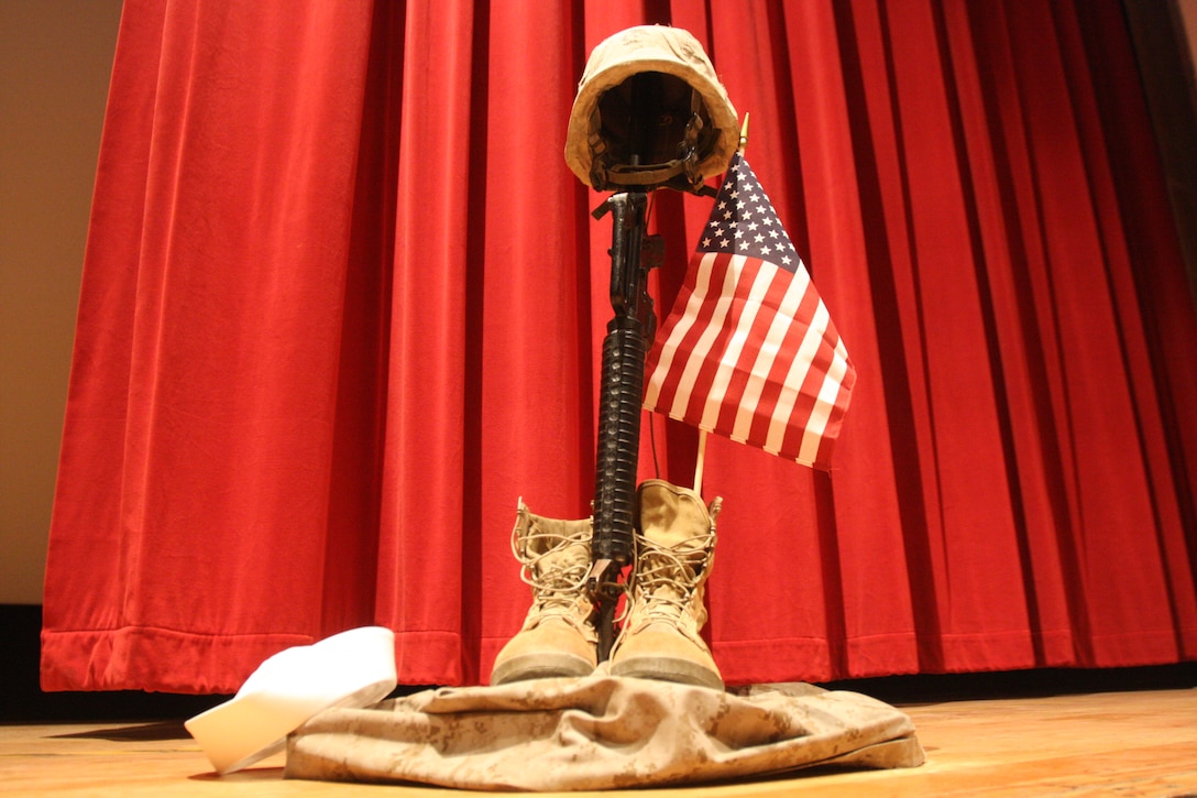 A memorial stands on the stage of the Combat Center’s Sunset Cinema during the 4th Annual Fallen Heroes Memorial Service Oct. 31.