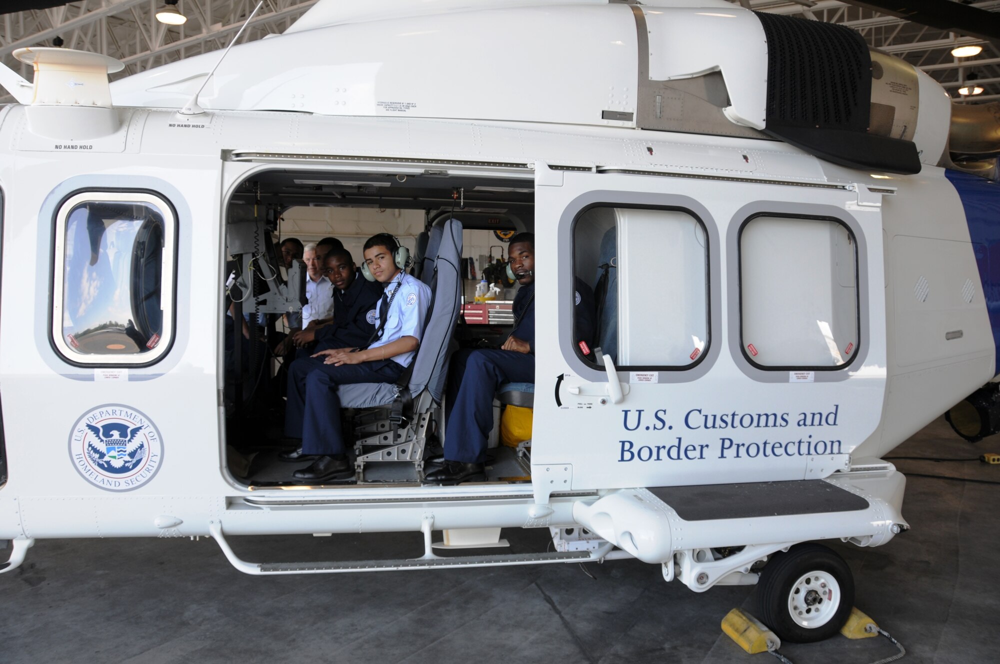 Air Force JROTC students from Booker T. Washington High School, tour an AgustaWestland AW139 helicopter assigned to the U.S. Customs and Border Protection, Miami Air and Marine Branch, located at Homestead Air Reserve Base on Oct. 31. Forty-eight Army and Air Force JROTC students from South Dade and Booker T. Washington High Schools visited Homestead ARB to take part in the annual Share the Passion Day.  The annual career day allows Homestead Reservists and other federal government employees to interact with local students, answering questions and demonstrating the various equipment and tools used in their respective specialty fields.  (U.S. Air Force photo/Tim Norton)