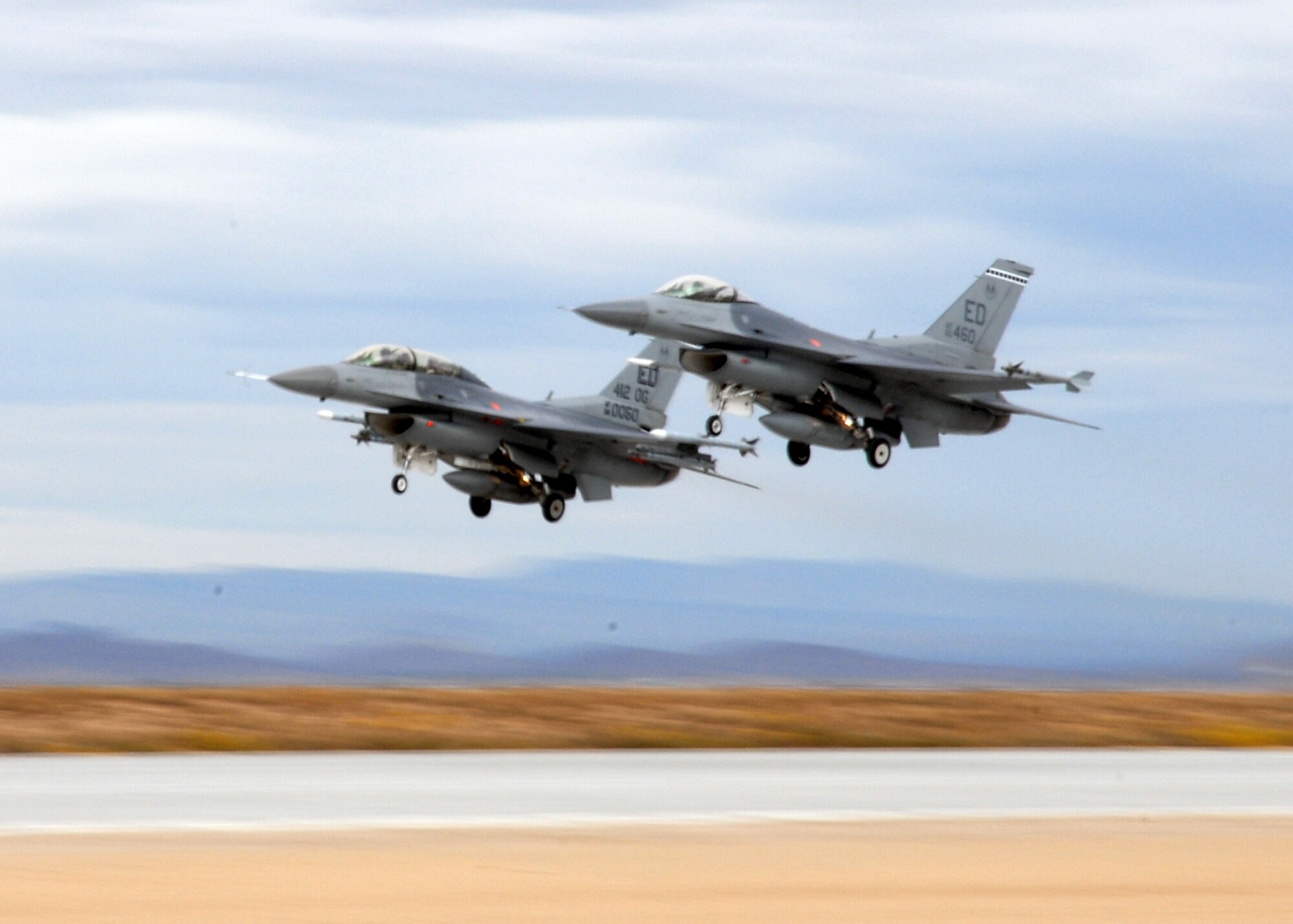 Two Edwards F-16 Fighting Falcons take off from the new base main runway Oct. 31. This marked the runway's first operational use. (Air Force photo by Airman 1st Class William O'Brien)