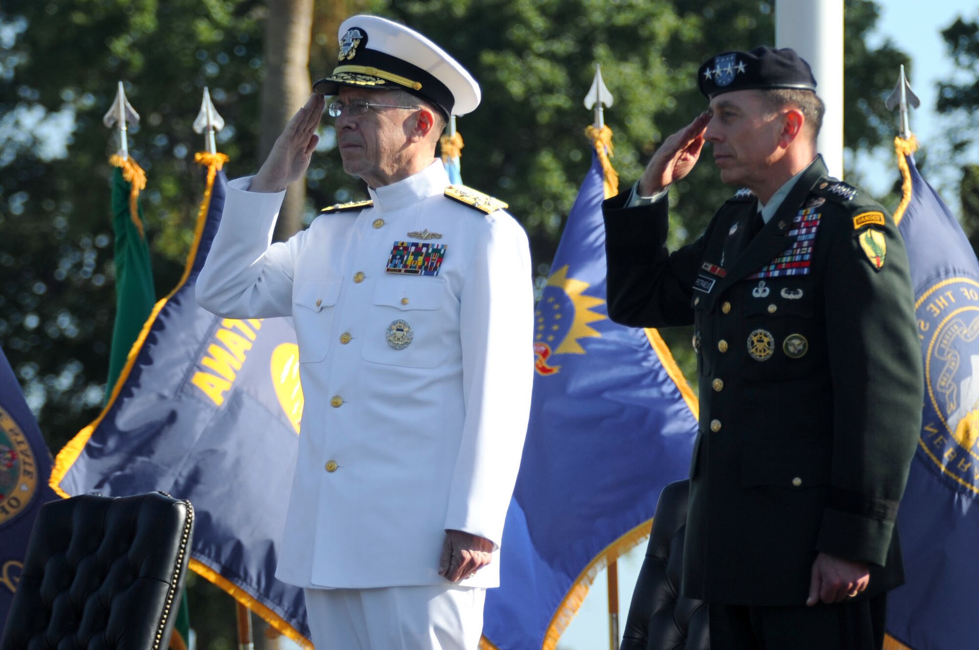 Army Gen. David H. Petraeus (right) and Chairman of the Joint Chiefs of Staff Adm. Mike Mullen salute the colors during the U.S. Central Command change of command ceremony Oct. 31 at MacDill Air Force Base, Fal. During the ceremony, General Petraeus assumed command of CENTCOM from acting commander Army Lt. Gen. Martin E. Dempsey.  (U.S. Air Force Photo/Staff Sgt. Joseph L. Swafford Jr.)