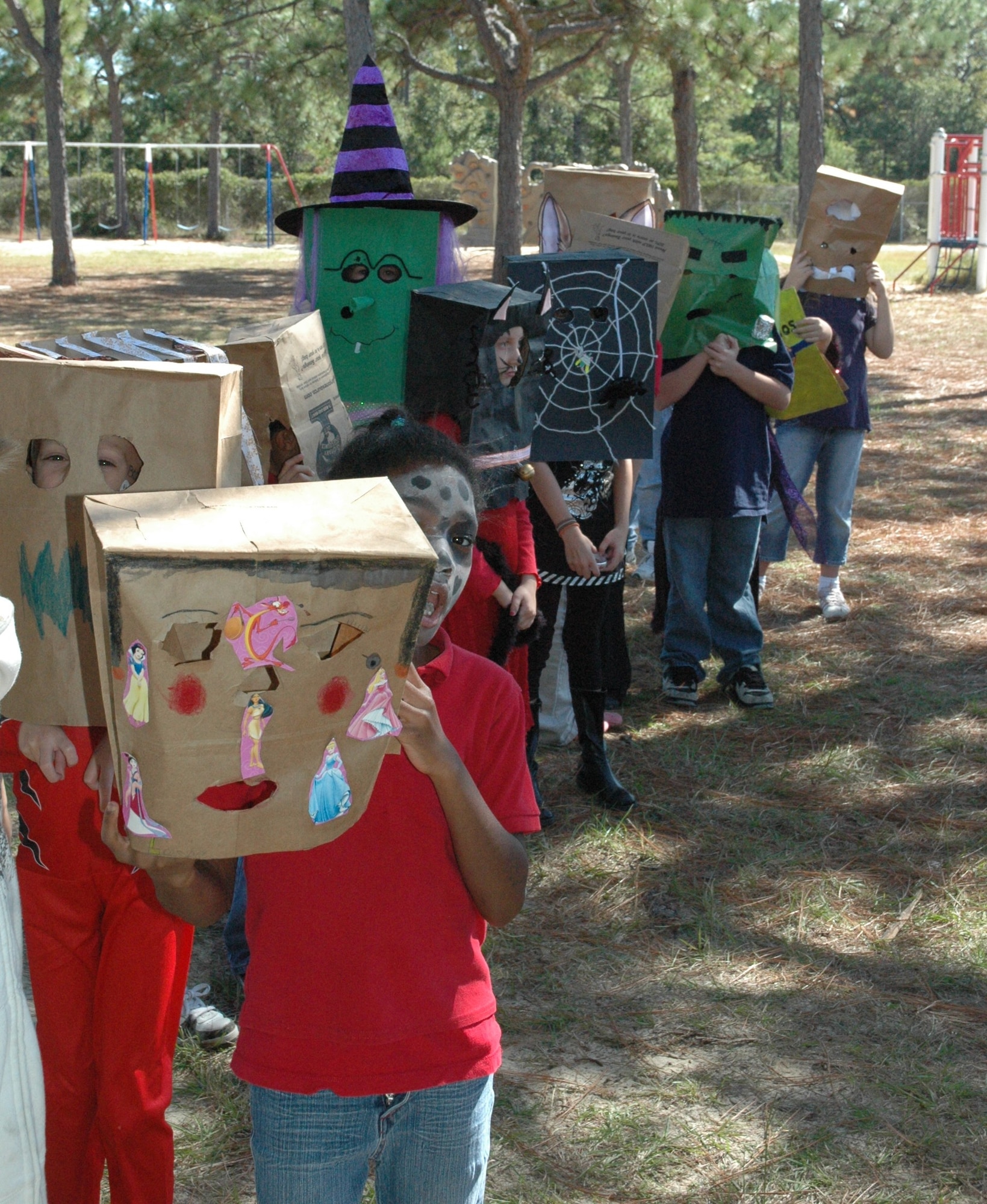 Tyndall Elementary School third graders parade around the school in their homemade paper bag masks to celebrate Halloween today. (U.S. Air Force photo by Airman 1st Class Veronica McMahon)