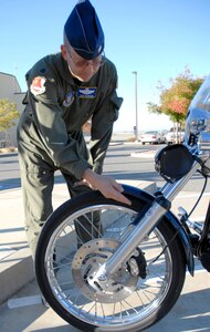 BEALE AIR FORCE BASE, Calif. -- Air Force Reservist Lt. Col. Lew Harding, 940th Air Refueling Wing chief of safety, shows the proper placement for the AF Form 15 on his motorcycle Oct. 16, 2008.  The decal signifies that the rider has completed a required motorcycle safety course. Beginning Dec. 1, all Beale AFB riders are required to display the this decal on their motorcycles, in accordance with Air Combat Command Supplement to AF Instruction 91-207.. (U.S. Air Force photo/MSgt. Ellen L. Hatfield)