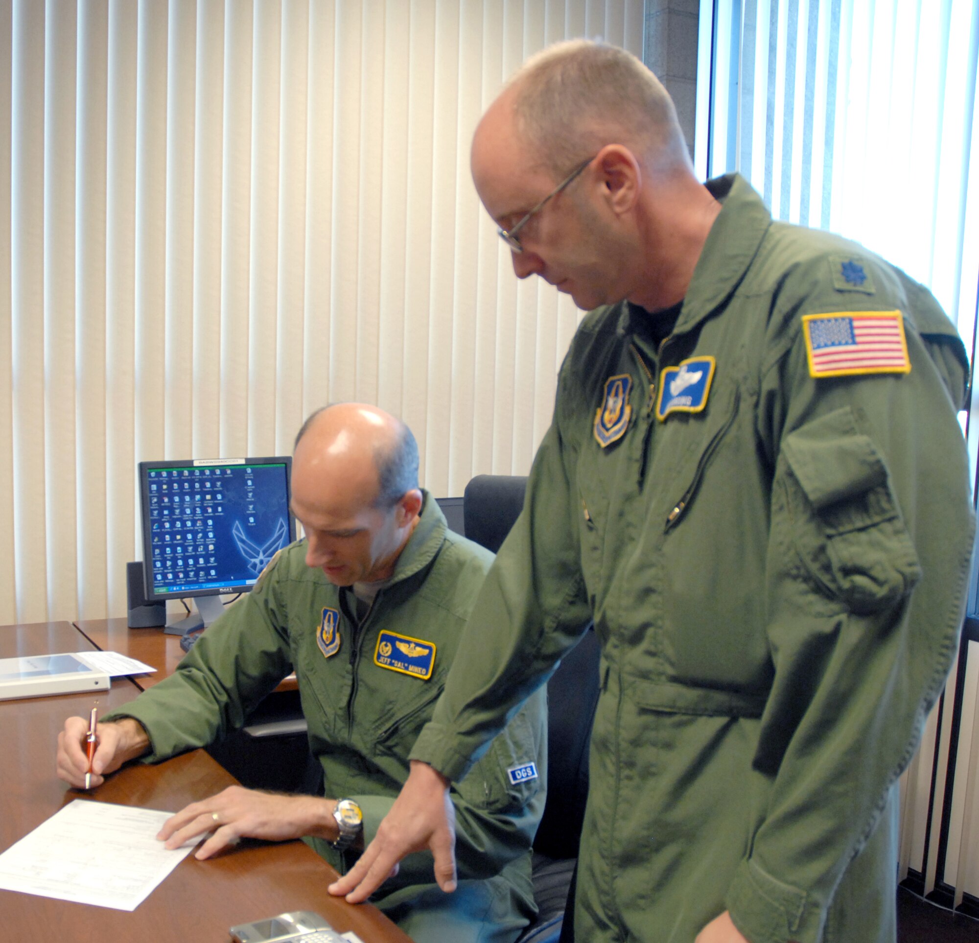 BEALE AIR FORCE BEALE, Calif. -- Air Force Reservist Col. Jeff "Sal" Mineo, 940th Air Refueling Wing commander, conducts a one on one motorcyle rider interview with Lt. Col Lew Harding, 940th ARW chief of safety Oct. 16, 2008. Beginning Dec. 1, all Beale AFB riders are required to display the AF Form 15 decal on their motorcycles, in accordance with Air Combat Command Supplement to AF Instruction 91-207. The decal signifies that the rider has completed a required motorcycle safety course. (U.S. Air Force photo/MSgt. Ellen L. Hatfield)