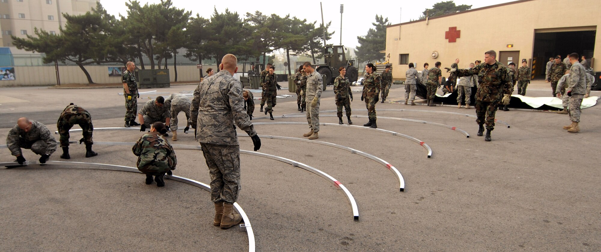 Reserve Airmen construct a medical staging facility Oct. 21 at Kunsan Air Base, South Korea. The medical reservists are deployed from Luke Air Force Base, Ariz. and Westover Air Force Base, Mass. (U.S. Air Force photo/Senior Airman Gustavo Gonzalez) 