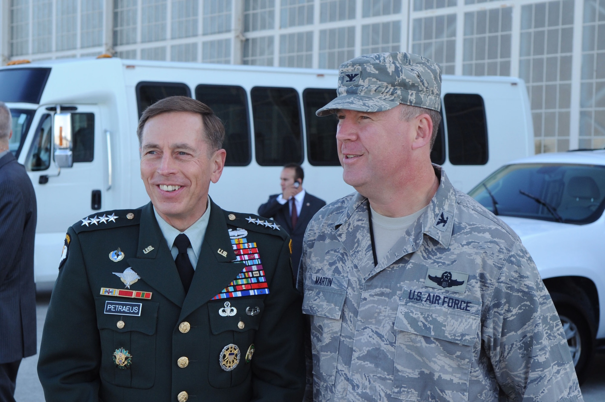 Macdill Air Force Base Fl- General David Petraeus, Commander United States Central Command (USCENTCOM) and Colonel Larry Martin, Commander 6th Air Mobility Wing greet each other as they wait for the Secretary of Defense Robert Gates to arrive on October 31, 2008 at Macdill AFB Tampa, Fl. General Petraeus is accepting command of USCENTCOM from Lieutenant General Martin Dempsey, acting Commander USCENTCOM. 