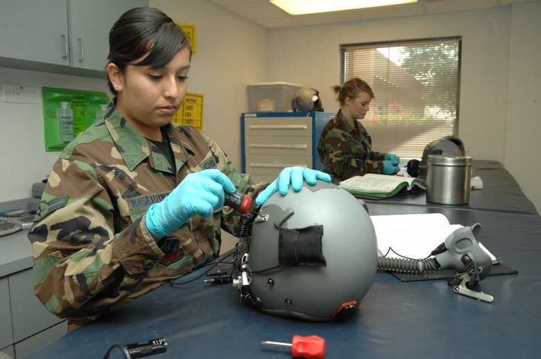 Airman 1st Class Trudy Nasetoynewa, 563rd Operations Support Squadron aircrew flight equipment, inspects a MBU-12P mask to ensure serviceability here, October 30. (U.S. Air Force photo/Senior Airman Noah R. Johnson)