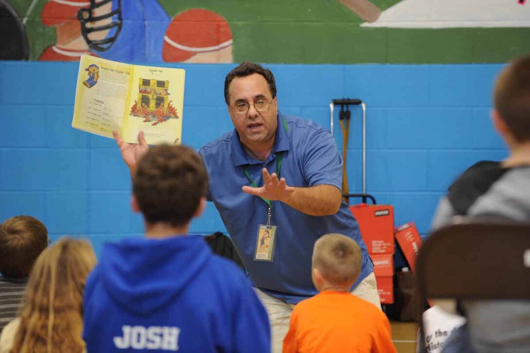 Sam Renick, author of the book, "It's A Habit, Sammy Rabbit!" visits Ellsworth to teach children how to be financially responsible here, Oct. 30. Mr. Renick sang songs, told stories and discussed the importance of saving money. (U.S. Air Force photo/Airman 1st Class Adam Grant)
