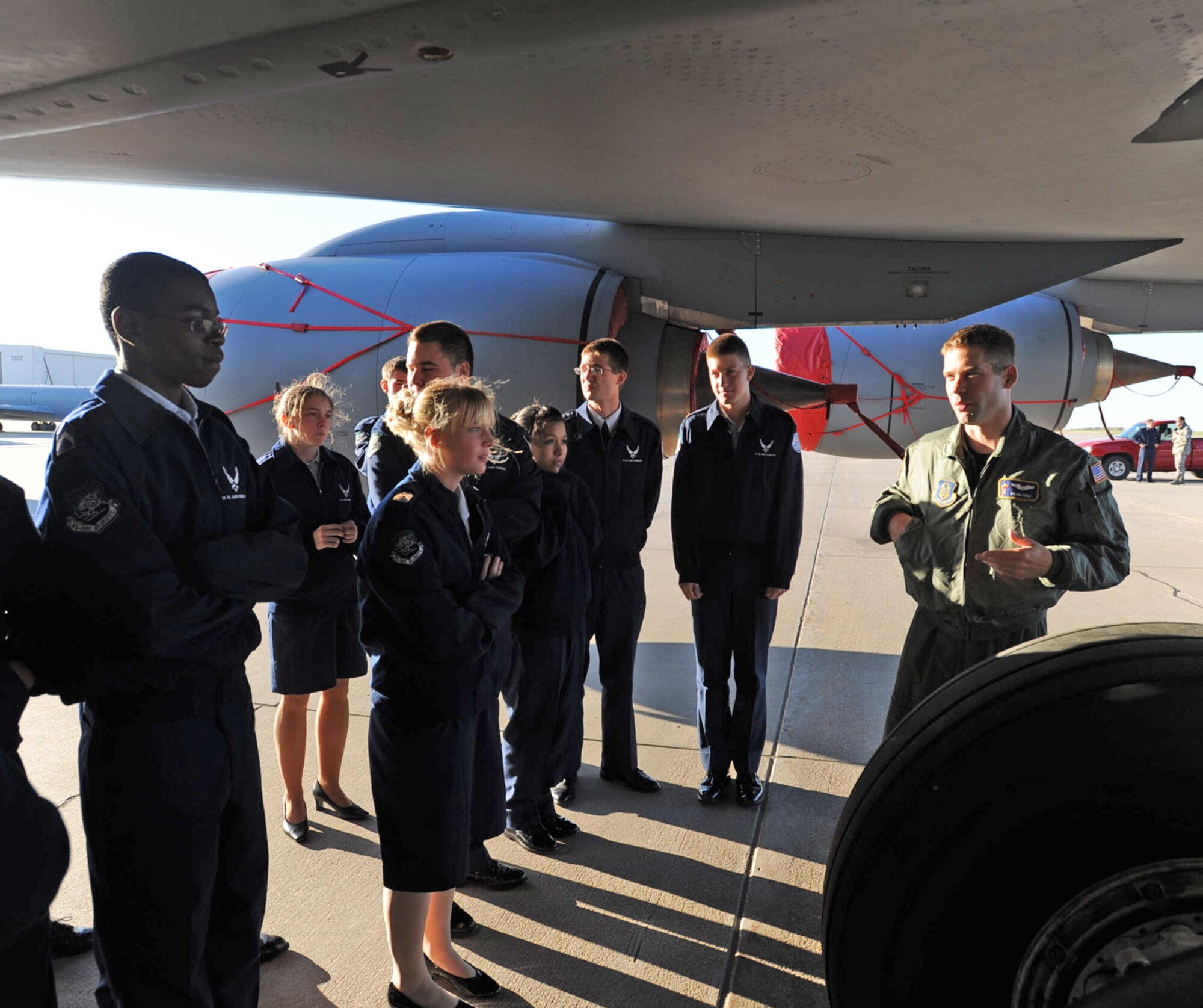 1st Lt. Brian Cole guides Air Force Junior Reserve Officer Training Corps cadets on an early morning tour around the outside of a KC-135 Stratotanker at McConnell Air Force Base, Kan. The cadets' school, Derby High School in Derby, Kan., is less than 10 miles from McConnell. Lieutenant Cole is a KC-135 pilot assigned to the 18th Air Refueling Squadron, the flying squadron of the 931st Air Refueling Group. The 931st is an Air Force Reserve Command unit assigned to McConnell. (U.S. Air Force photo/Tech. Sgt. Jason Schaap)