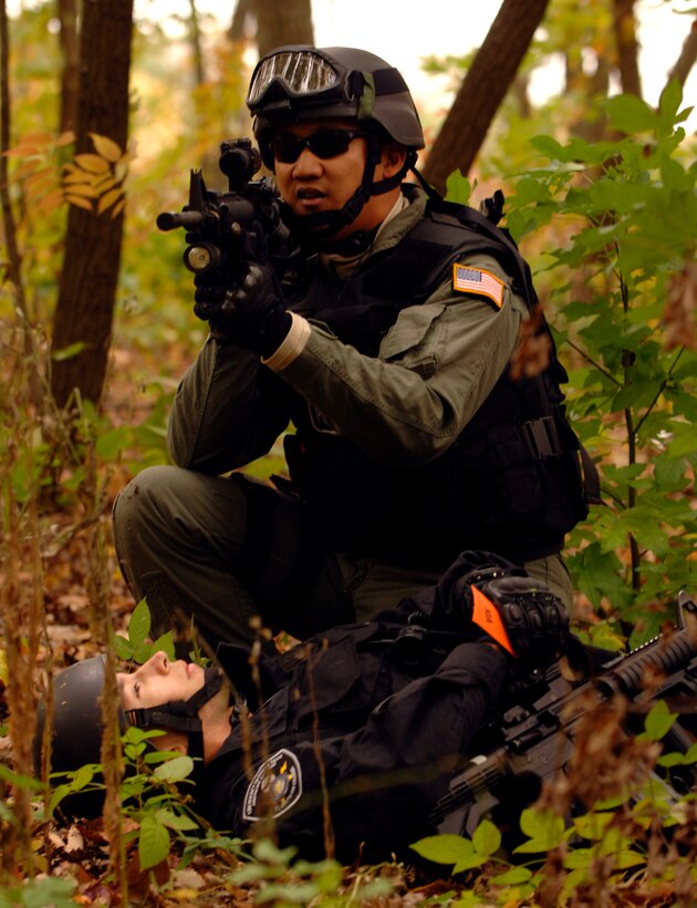 A member of the Emergency Services Team secures a fellow member during the Capital Shield Exercise Oct. 27. EST is a highly seasoned and trained response team within the SFS that is equipped and staffed to respond to high risk incidents and usual occurrences in a safe and effective manner. Scenarios like this help to train security forces so they are prepared in the event of a real world situation. The exercise consisted of multiple scenarios including suspicious packages, mass casualty training, and terrorist attack procedures. Capital Shield is an annual exercise in the National Capital Region involving civilian and military authorities such as 316th Wing, 779th Medical Group, 89th Airlift Wing, Prince George’s County Fire and Police Departments and Maryland State Police. (U.S. Air Force photo by Senior Airman Steven Doty)