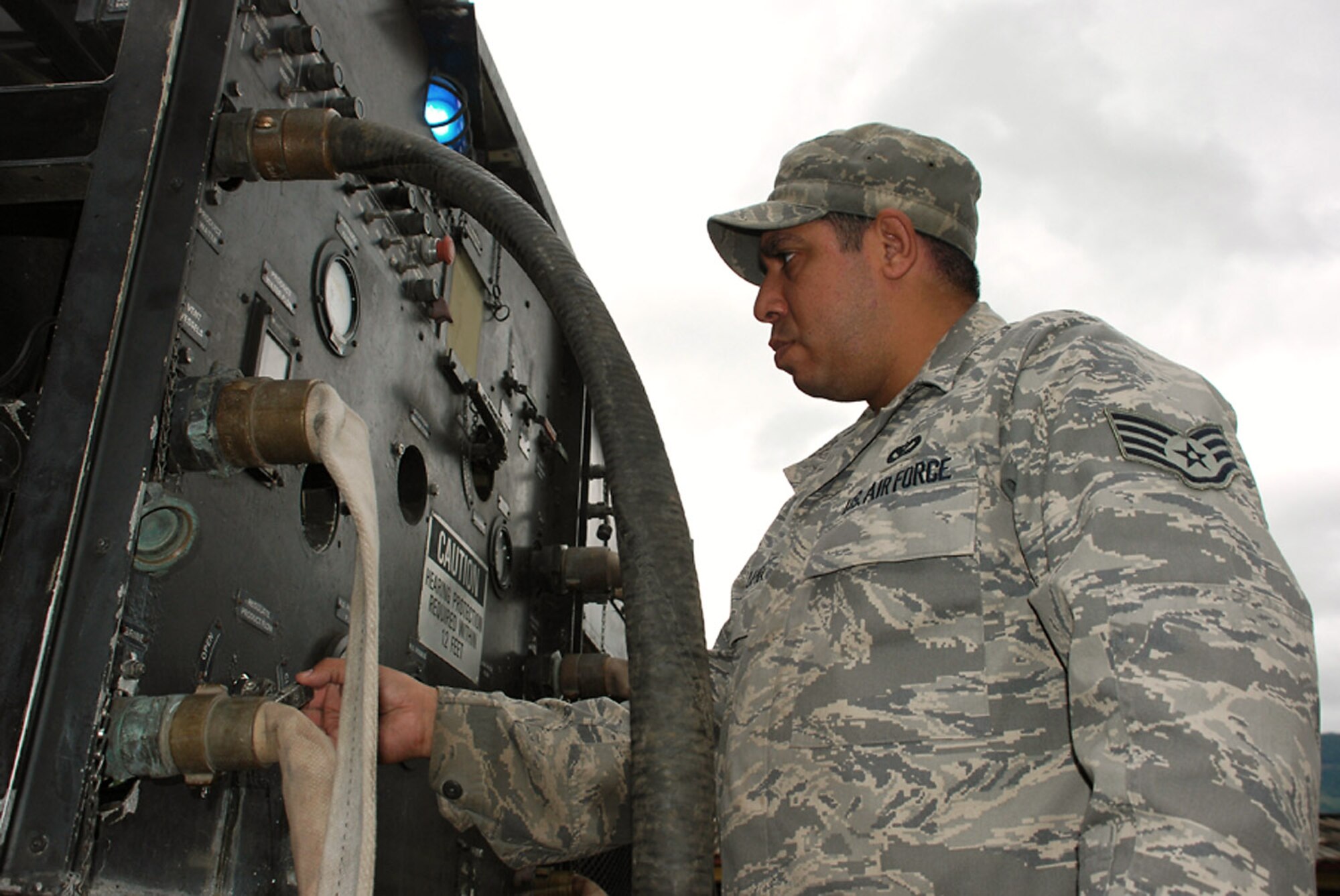 Staff Sgt. Nick Luna works on a water filtration machine Oct. 29 at La Paz, Honduras. Servicemembers from Joint Task Force-Bravo are participating in a 10-day operation in a nearby community to filter well water. The well water became undrinkable after more than a weeklong stretch of rain caused flooding in the area. Sergeant Luna is assigned to Soto Cano Air Base, Honduras, and deployed from Dyess Air Force Base, Texas. (U.S. Army photo/Spc. Ethan Anderson)
