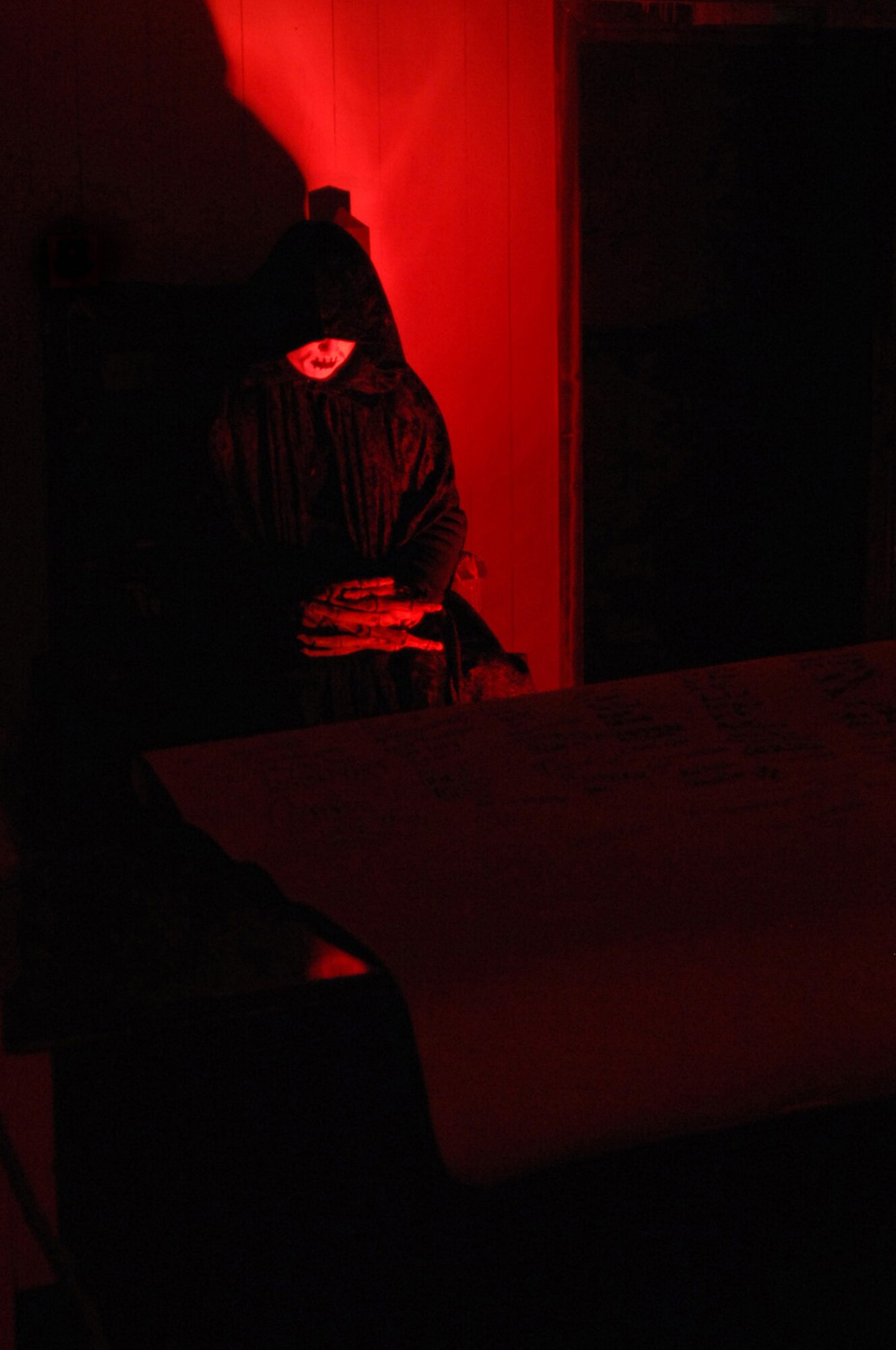 “The Grim Reaper” awaits patrons entering the Logistics Readiness Squadron Communications Squadron Haunt World here Oct. 30, 2008. “The Grim Reaper” brief patrons of safety measures, emergency exits and health concerns for anyone entering the 13 room haunted house. The Haunted house will be held in Building 518. Hours of operation are 6 to 11 p.m., price is $6 for all ages. (U.S. Air Force photo by Senior Airman Teresa M. Hawkins)