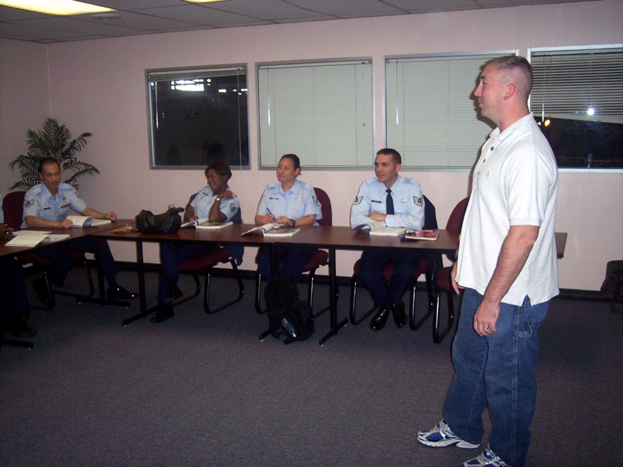 Tech. Sgt. Jeffery Dean, 421st Combat Training Squadron, instructs 305th Logistics Readiness Squadron students during a recent Speech 101 class, which was hosted by Burlington County College. BCC offered the accelerated lunch time speech class to 15 305th LRS personnel at the squadron, which provided a more convenient location and familiarity to unit personnel. BCC is one of five on-base colleges that provide various degree programs to base personnel. To coordinate a class at your squadron, contact McGuire’s Education office at (609) 754-3019. (U.S. Air Force courtesy photo)