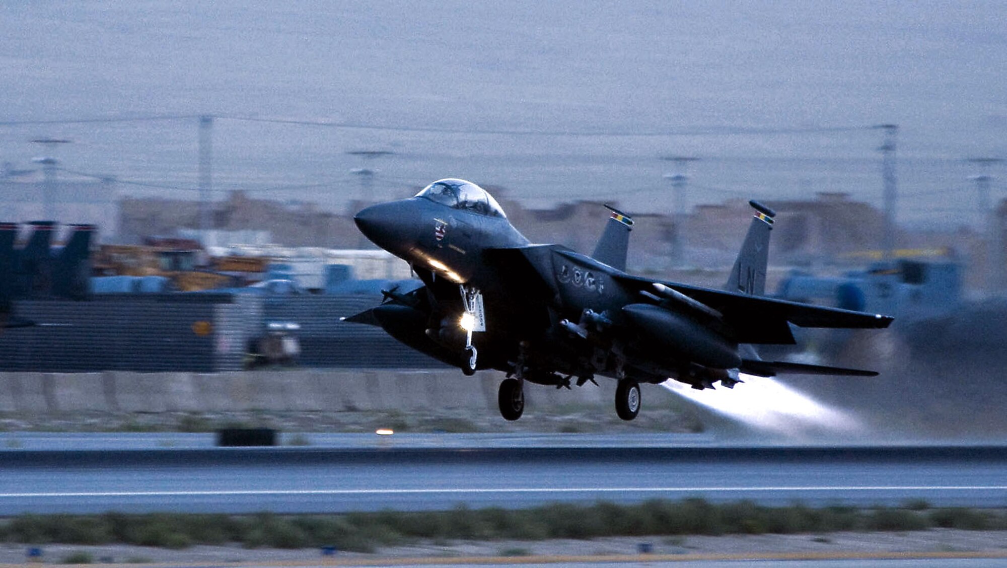 An F-15E Strike Eagle takes off from a Southwest Asia air base. The F-15E is a dual-role fighter designed to perform air-to-air and air-to-ground missions. (U.S. Air Force photo/Staff Sgt. Samuel Morse)