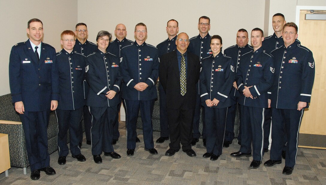 Captain Michael J. Willen (left), Commander of the USAF Heartland of America Band, Mr. Joseph Alessi (center), Principal Trombone with the New York Philharmonic, and the USAF Brass in Blue following 'Slides Across the Heartland' presented on Monday, October 20, 2008 at the Holland Performing Arts Center in Omaha, NE.