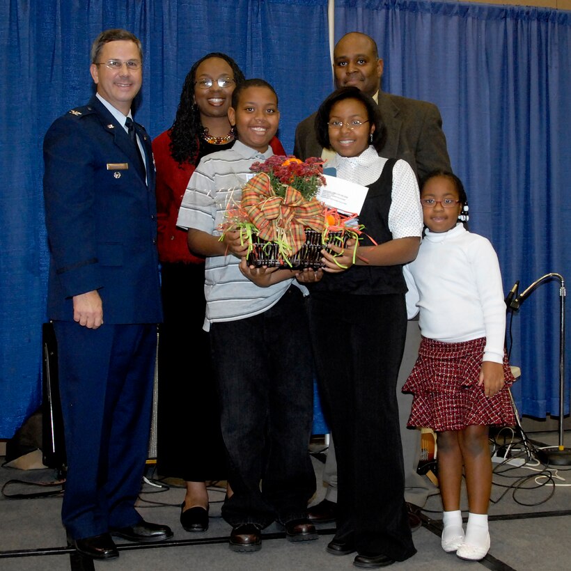 Maj. Shevonne Scott, husband Greg and children Sekayi, Malcom and Sienna win Sheppard Family of the Year during the Military Family and Deployer Appreciation Dinner at the Multi Purpose Events Center Oct. 30. (U.S. Air Force photo/Mike Litteken)