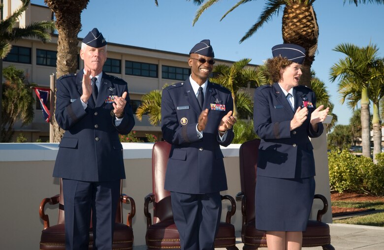 Lt. Gen. William Shelton, Brig. Gen. Edward L. Bolton, Jr., and Brig. Gen. Susan Helms, thank and acknowledge the nearly 500 Airmen and civilians who participated in and watched the change of command ceremony Oct. 28. (U.S. Air Force photo by Jim Laviska)